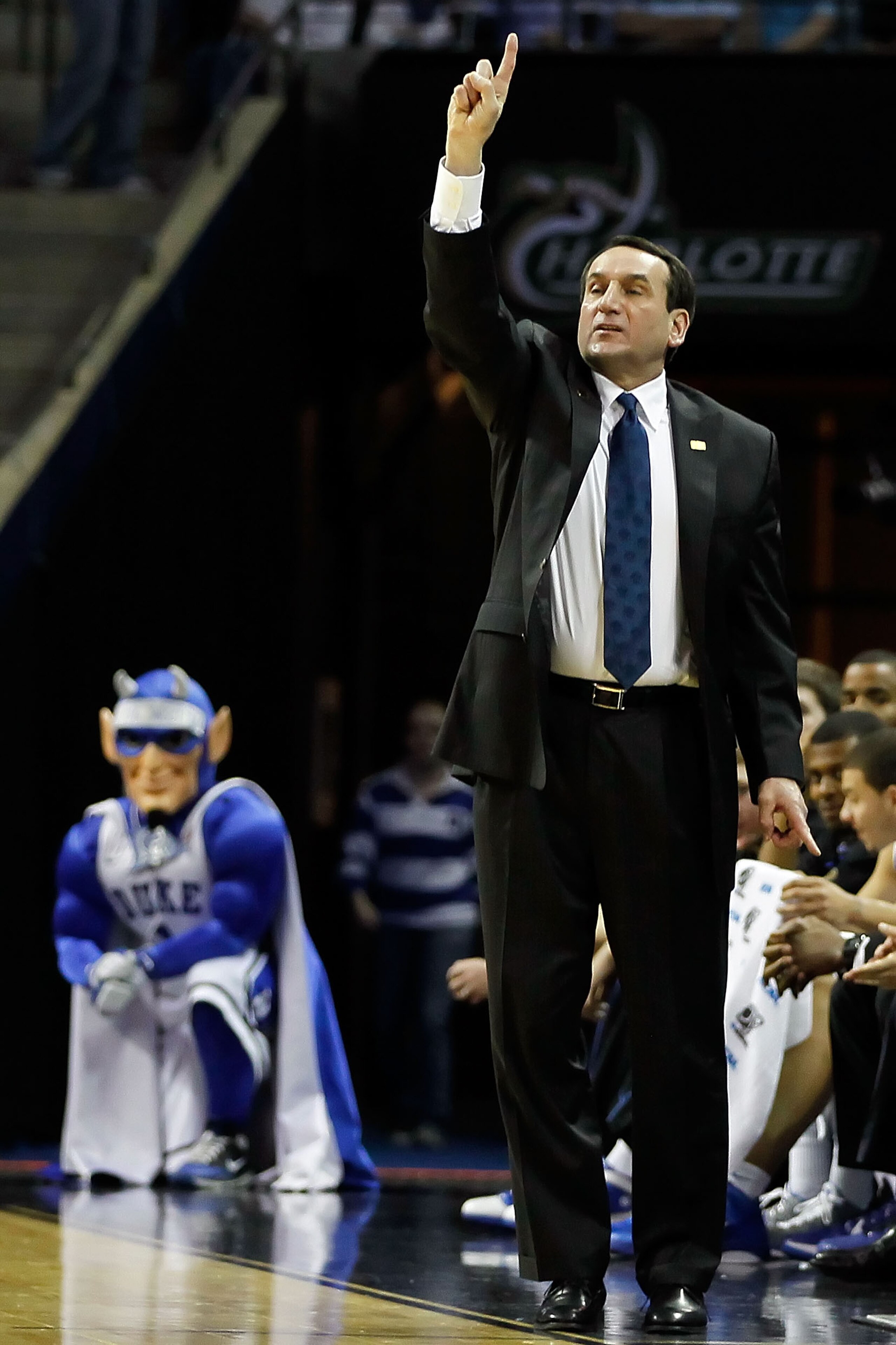CHARLOTTE, NC - MARCH 20: Head coach Mike Krzyzewski of the Duke Blue Devils reacts while taking on the Michigan Wolverines during the third round of the 2011 NCAA men's basketball tournament at Time Warner Cable Arena on March 20, 2011 in Charlotte, Nor CHARLOTTE, NC - MARCH 20: Head coach Mike Krzyzewski of the Duke Blue Devils reacts while taking on the Michigan Wolverines during the third round of the 2011 NCAA men's basketball tournament at Time Warner Cable Arena on March 20, 2011 in Charlotte, Nor