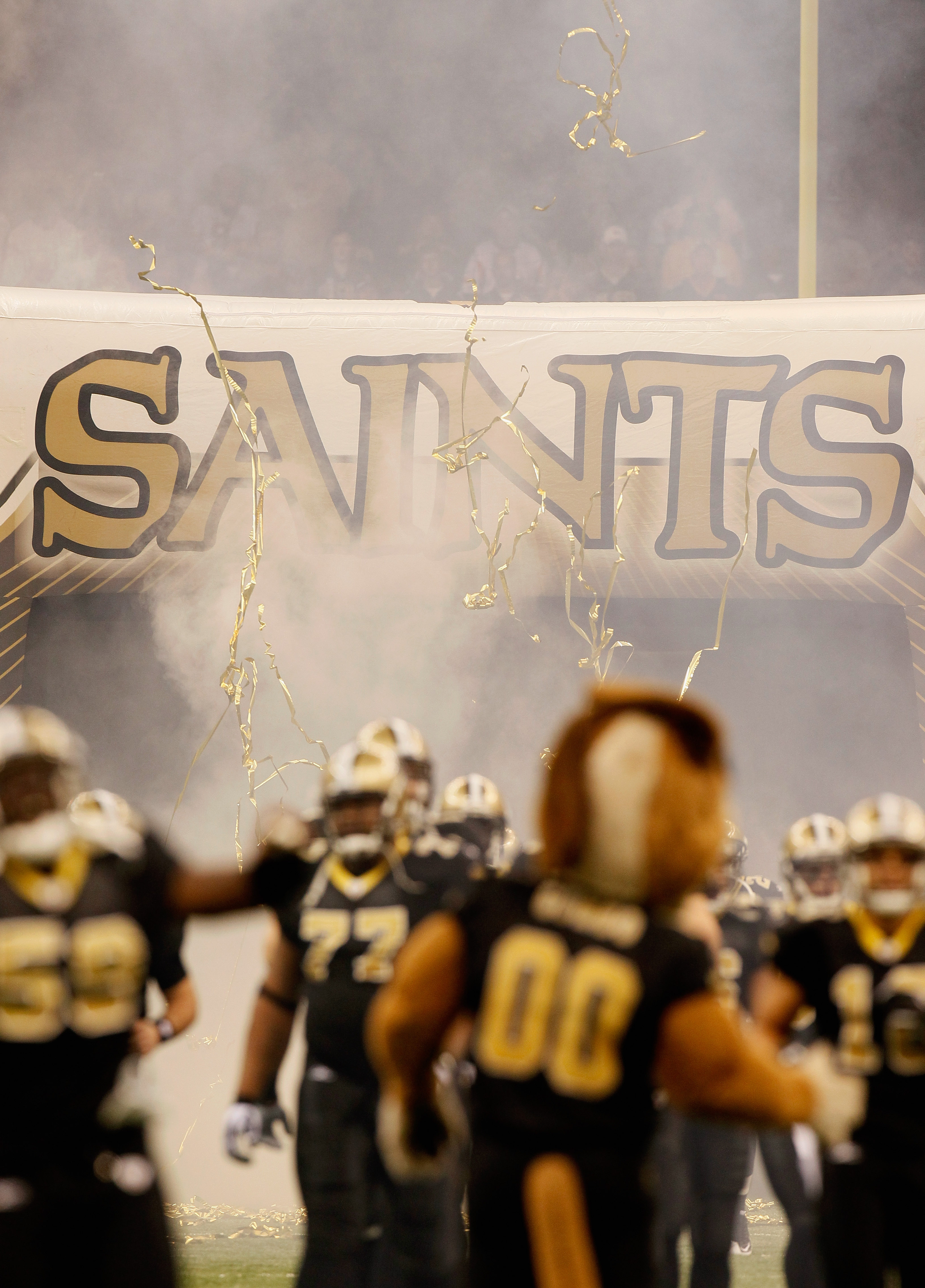 NEW ORLEANS - NOVEMBER 21:  The New Orleans Saints enter the field to face the Seattle Seahawks at Louisiana Superdome on November 21, 2010 in New Orleans, Louisiana.  (Photo by Kevin C. Cox/Getty Images)