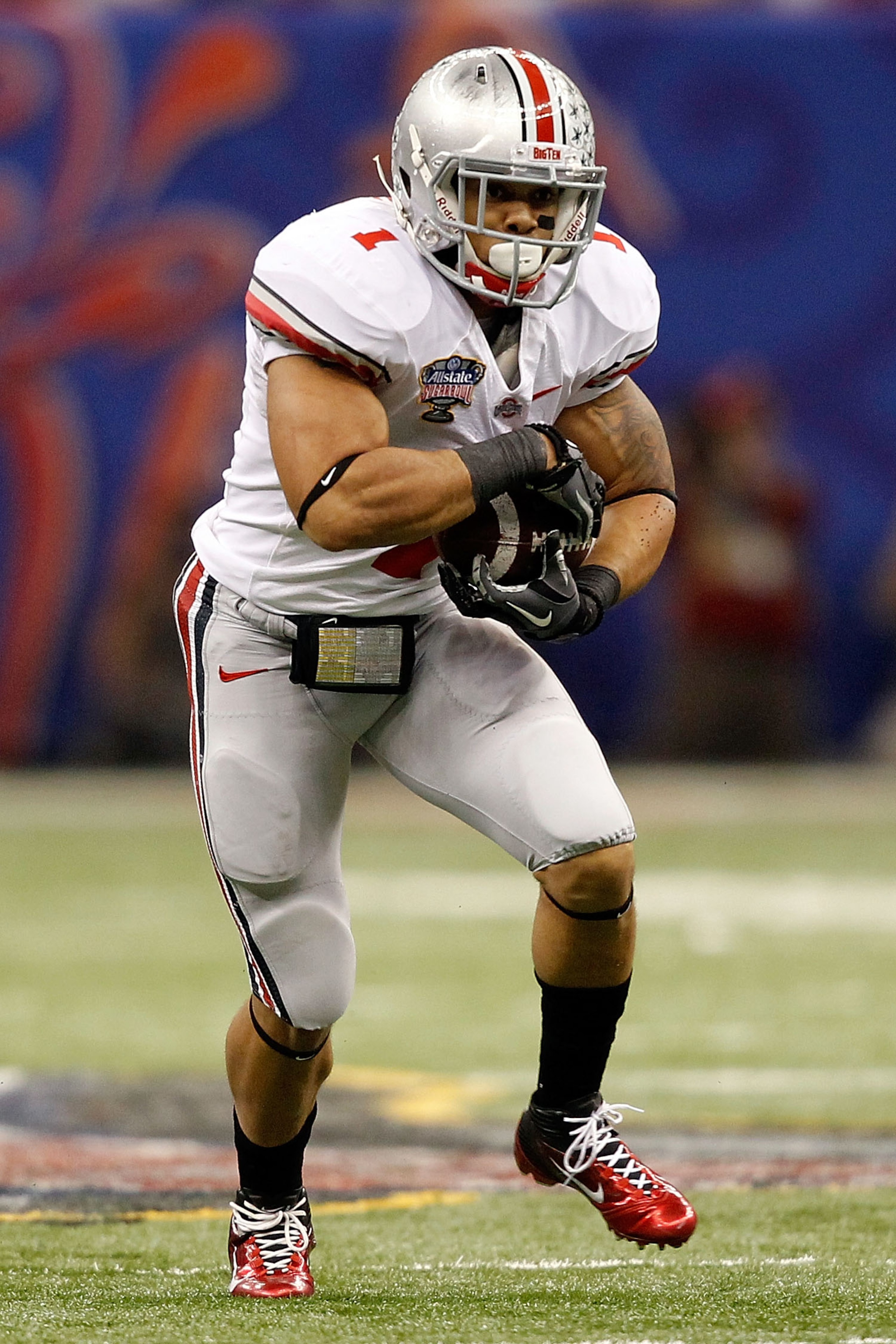 NEW ORLEANS, LA - JANUARY 04: Dan Herron #1 of the Ohio State Buckeyes runs the ball against the Arkansas Razorbacks during the Allstate Sugar Bowl at the Louisiana Superdome on January 4, 2011 in New Orleans, Louisiana. (Photo by Matthew Stockman/Getty NEW ORLEANS, LA - JANUARY 04: Dan Herron #1 of the Ohio State Buckeyes runs the ball against the Arkansas Razorbacks during the Allstate Sugar Bowl at the Louisiana Superdome on January 4, 2011 in New Orleans, Louisiana. (Photo by Matthew Stockman/Getty