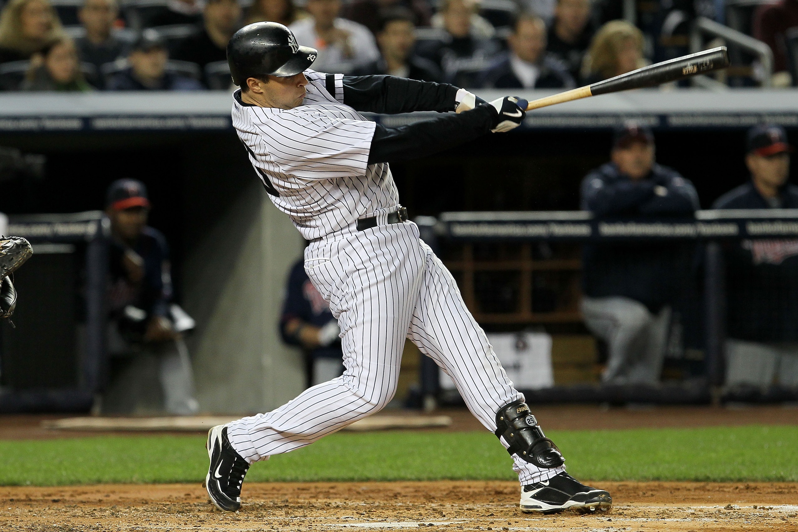 NEW YORK - OCTOBER 09: Mark Teixeira #25 of the New York Yankees hits a RBI single in the bottom of the third inning against the Minnesota Twins during Game Three of the ALDS part of the 2010 MLB Playoffs at Yankee Stadium on October 9, 2010 in the Bronx NEW YORK - OCTOBER 09: Mark Teixeira #25 of the New York Yankees hits a RBI single in the bottom of the third inning against the Minnesota Twins during Game Three of the ALDS part of the 2010 MLB Playoffs at Yankee Stadium on October 9, 2010 in the Bronx