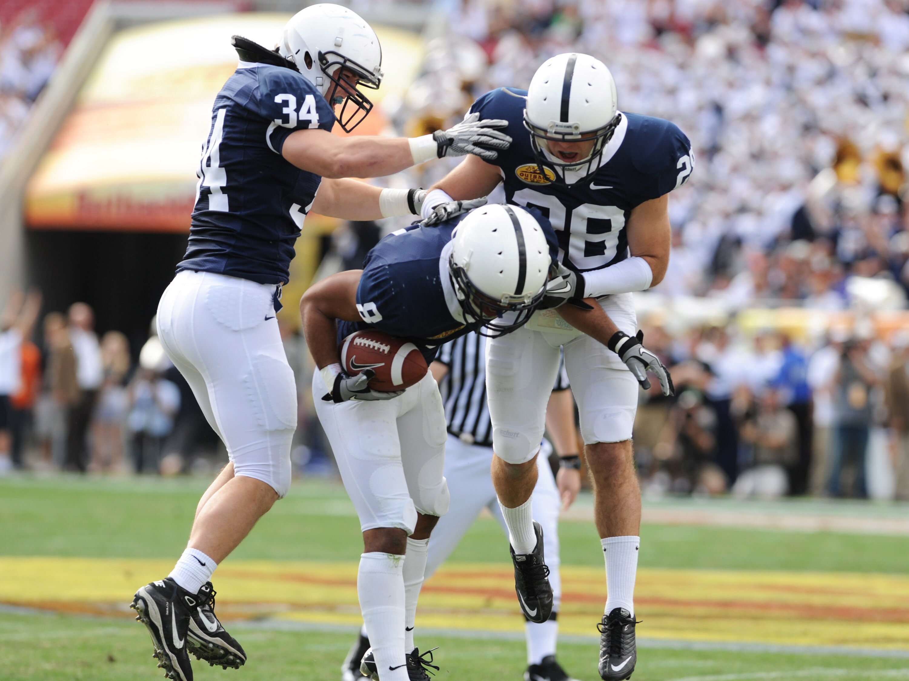 TAMPA, FL - JANUARY 1:  Cornerback D'Anton Lynn #8 of the Penn State Nittany Lions intercepts a first-quarter pass against the Florida Gators January 1, 2011 in the 25th Outback Bowl at Raymond James Stadium in Tampa, Florida.  (Photo by Al Messerschmidt/