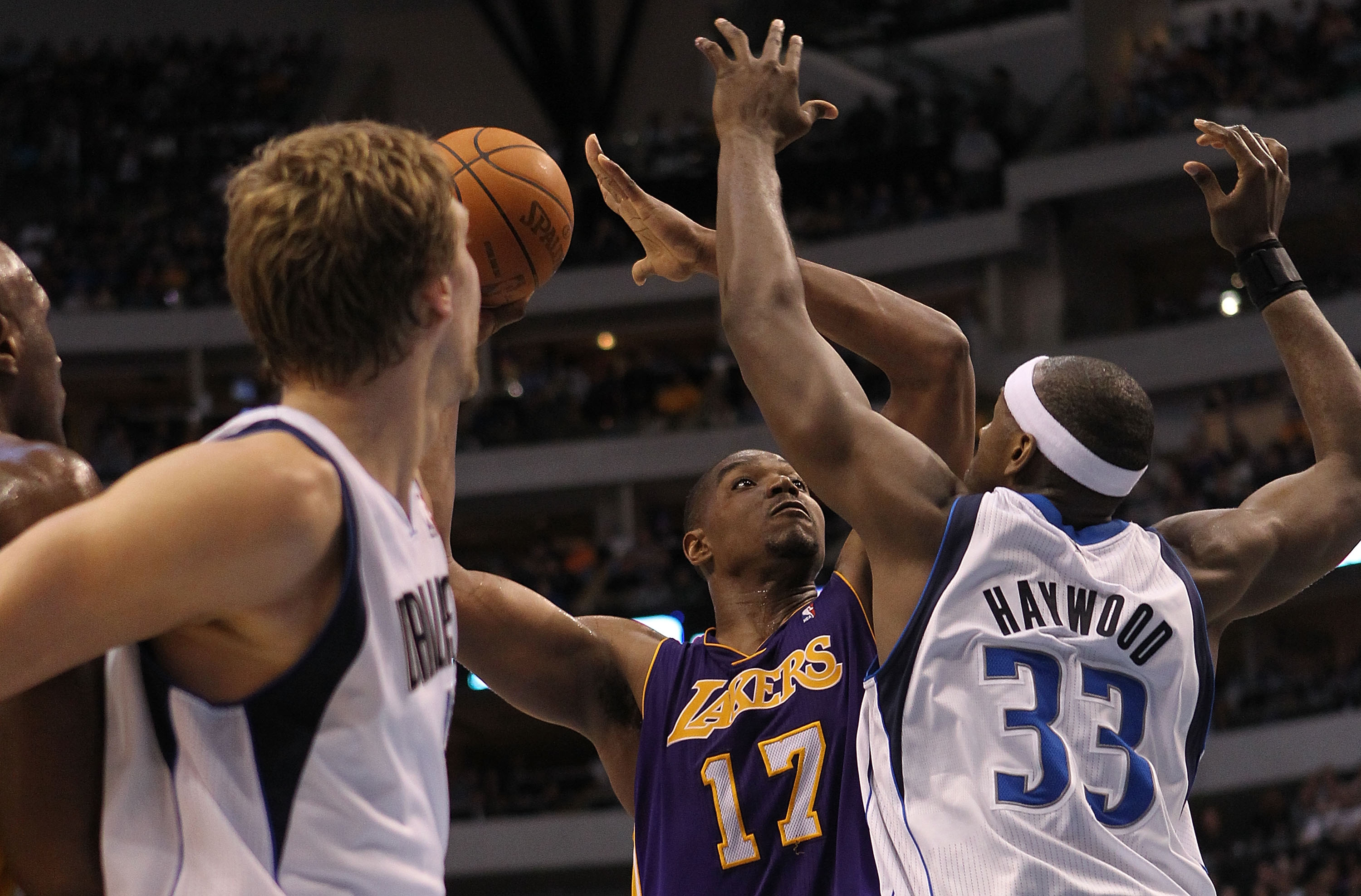 DALLAS, TX - MARCH 12:  Center Andrew Bynum #17 of the Los Angeles Lakers takes a shot against Brendan Haywood #33 of the Dallas Mavericks at American Airlines Center on March 12, 2011 in Dallas, Texas.  NOTE TO USER: User expressly acknowledges and agree