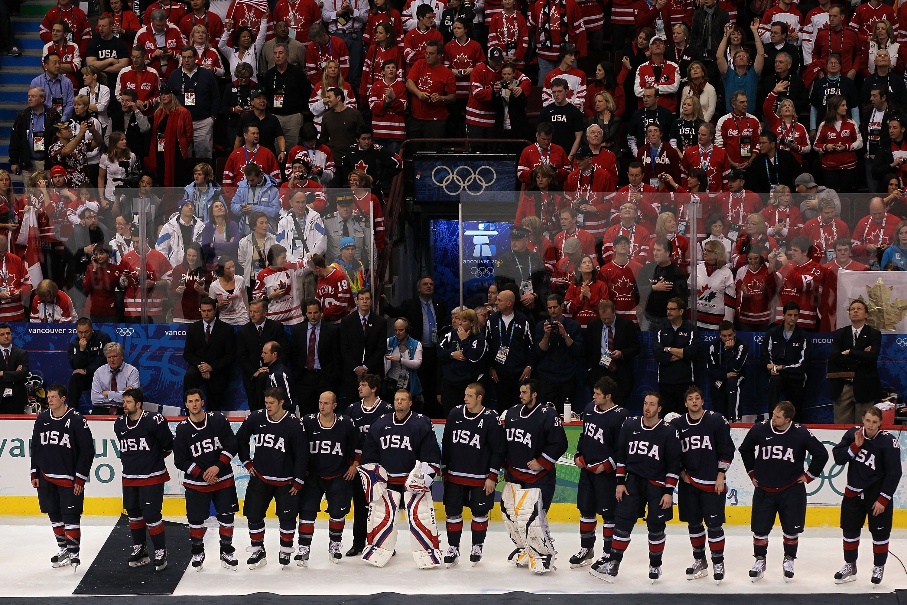 VANCOUVER, BC - FEBRUARY 28:  Dejected Team USA players wait to receive their silver medals following their 3-2 overtime defeat in the ice hockey men's gold medal game between USA and Canada on day 17 of the Vancouver 2010 Winter Olympics at Canada Hockey