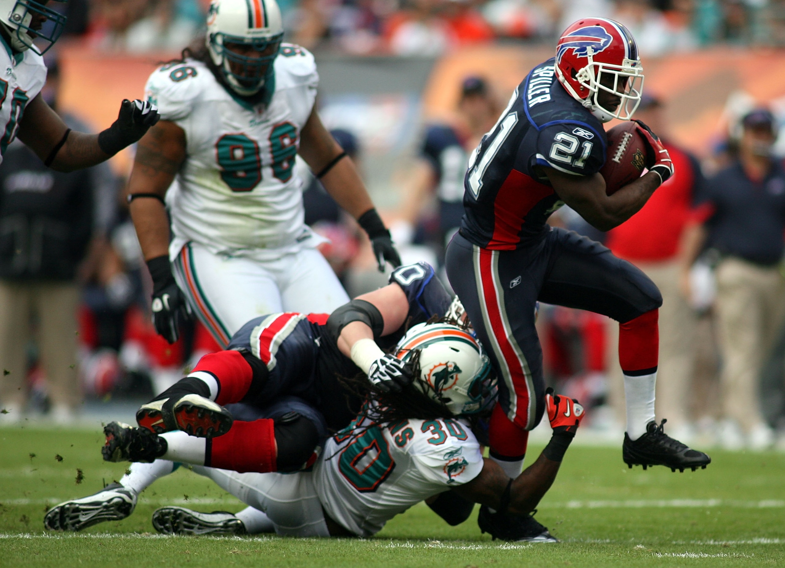 MIAMI - DECEMBER 19:  Running Back C.J. Spiller #21 of the Buffalo Bills runs against the Miami Dolphins at Sun Life Stadium on December 19, 2010 in Miami, Florida.The Bills defeated the Dolphins 17-14.  (Photo by Marc Serota/Getty Images)