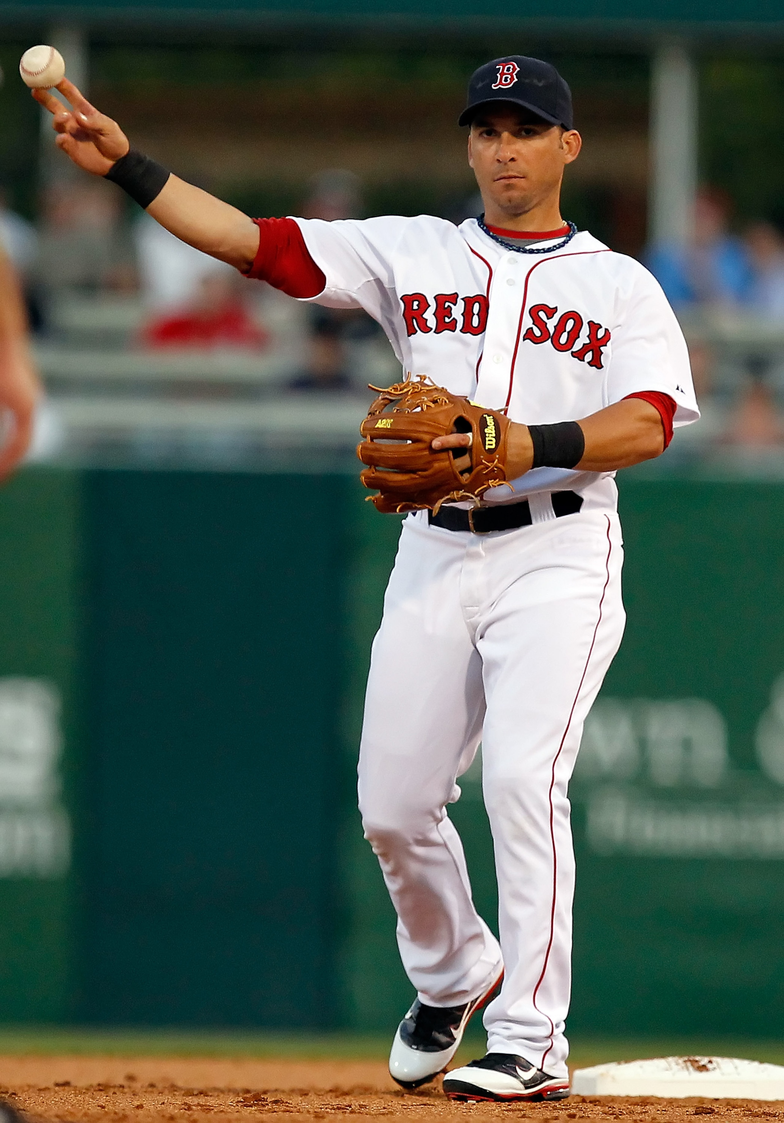 FORT MYERS, FL - MARCH 14:  Shortstop Marco Scutaro #16 of the Boston Red Sox throws the ball against the New York Yankees during a Grapefruit League Spring Training Game at City of Palms Park on March 14, 2011 in Fort Myers, Florida.  (Photo by J. Meric/