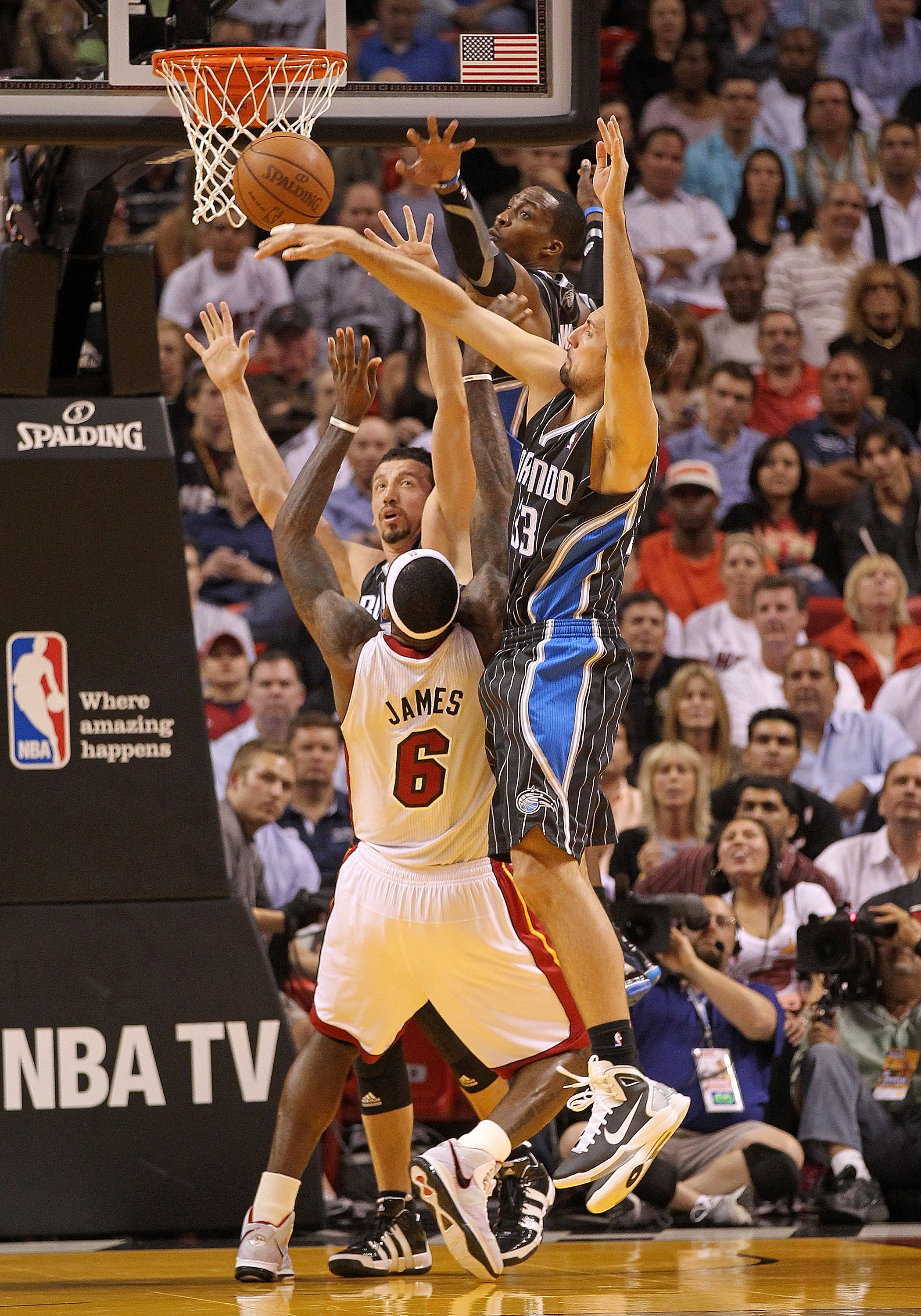 MIAMI, FL - MARCH 03:  LeBron James #6 of the Miami Heat shoots over Hedo Turkoglu #15, Ryan Anderson #33, and Dwight Howard #12 of the Orlando Magic during a game at American Airlines Arena on March 3, 2011 in Miami, Florida. NOTE TO USER: User expressly