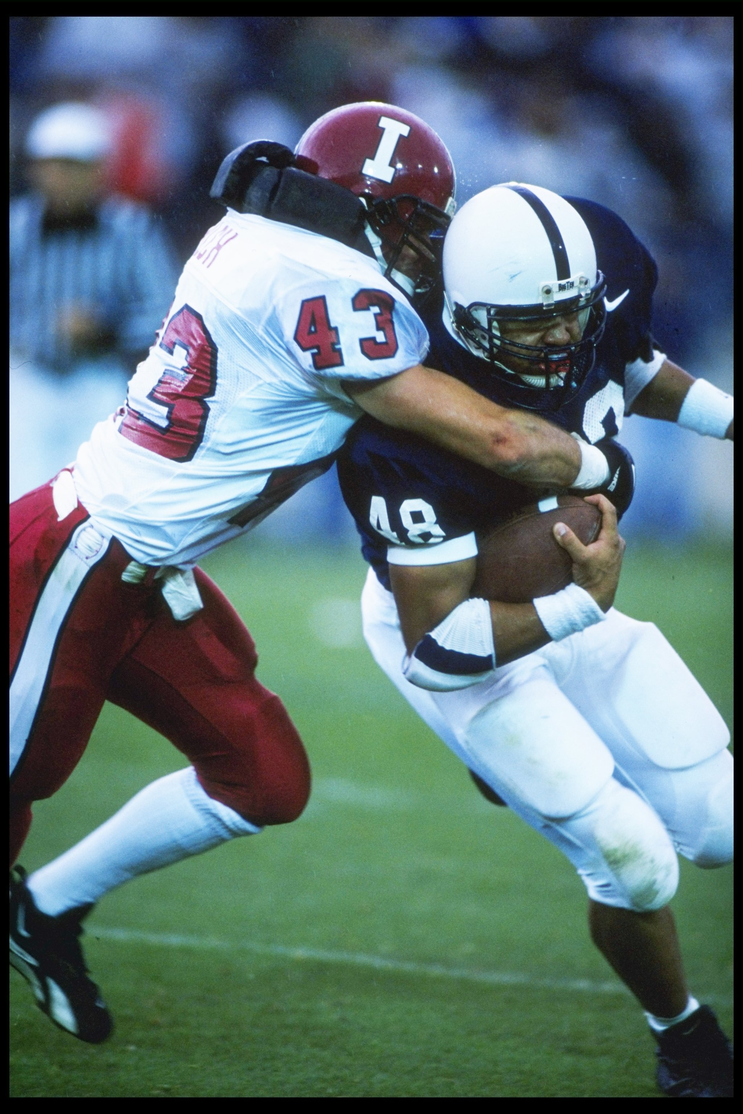 28 Oct 1995:  Runningback Carl Grey of the Penn State Nittiny Lions tries to break free of linebacker John Pilch of the Indiana Hoosiers at Beaver Stadium in University Park, Pennsylvania.  Penn State won the game 45-21. Mandatory Credit: Ken White  /Alls