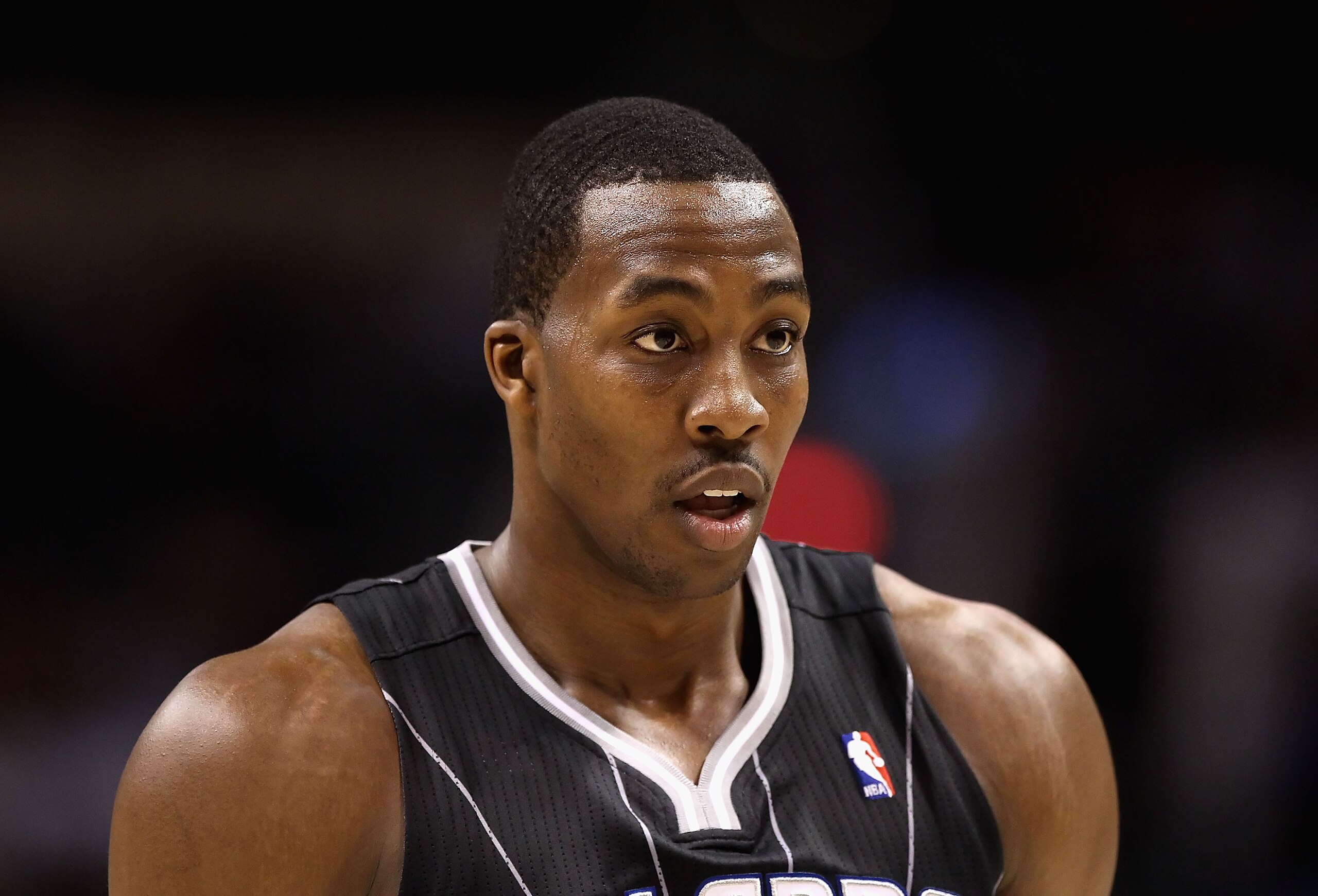 PHOENIX, AZ - MARCH 13: Dwight Howard #12 of the Orlando Magic during the NBA game against the Phoenix Suns at US Airways Center on March 13, 2011 in Phoenix, Arizona. The Magic defeated the Suns 111-88. NOTE TO USER: User expressly acknowledges and agre PHOENIX, AZ - MARCH 13: Dwight Howard #12 of the Orlando Magic during the NBA game against the Phoenix Suns at US Airways Center on March 13, 2011 in Phoenix, Arizona. The Magic defeated the Suns 111-88. NOTE TO USER: User expressly acknowledges and agre
