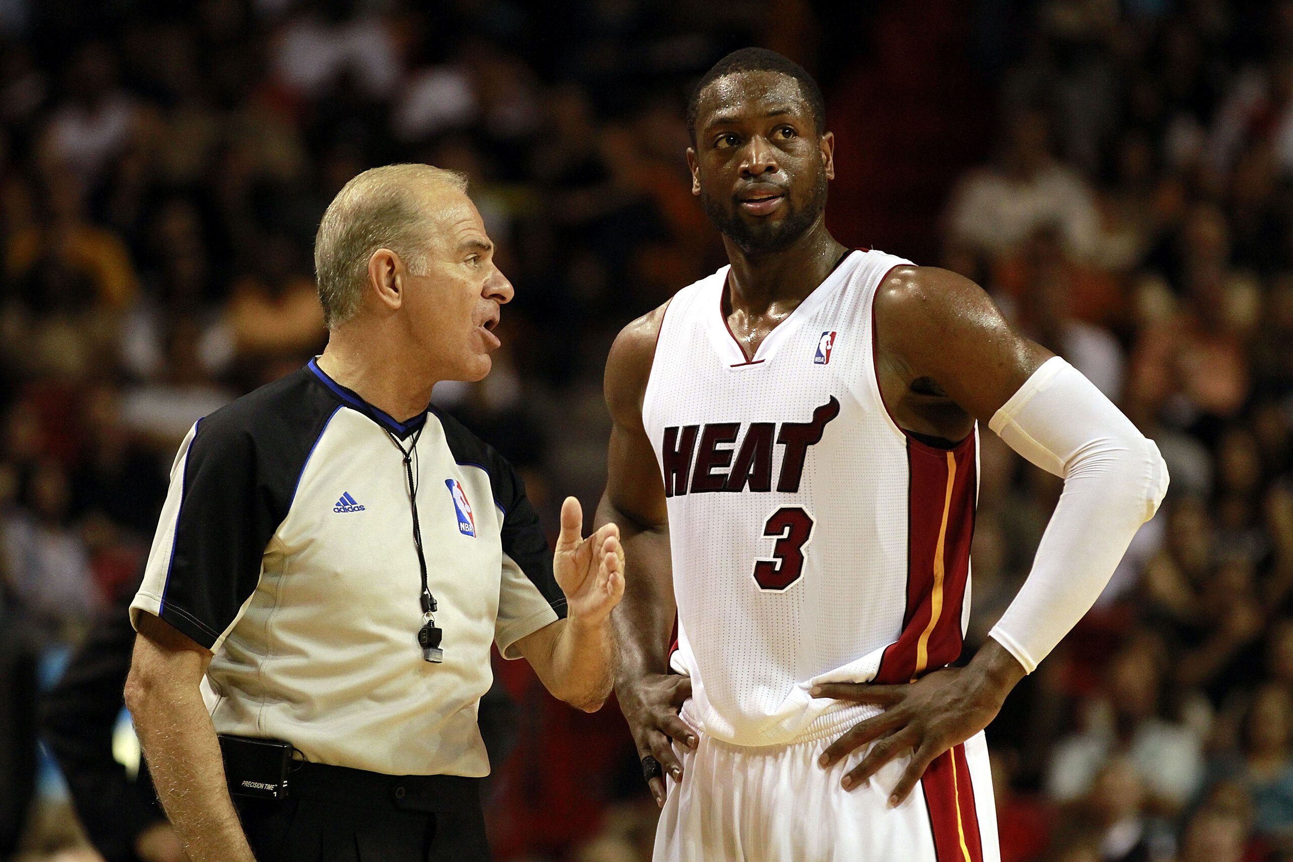 MIAMI, FL - MARCH 19: Guard Dwyane Wade #3 of the Miami Heat chats with the referee against the Denver Nuggets at American Airlines Arena on March 19, 2011 in Miami, Florida. The Heat defeated the Nuggets 103-98. NOTE TO USER: User expressly acknowledges MIAMI, FL - MARCH 19: Guard Dwyane Wade #3 of the Miami Heat chats with the referee against the Denver Nuggets at American Airlines Arena on March 19, 2011 in Miami, Florida. The Heat defeated the Nuggets 103-98. NOTE TO USER: User expressly acknowledges