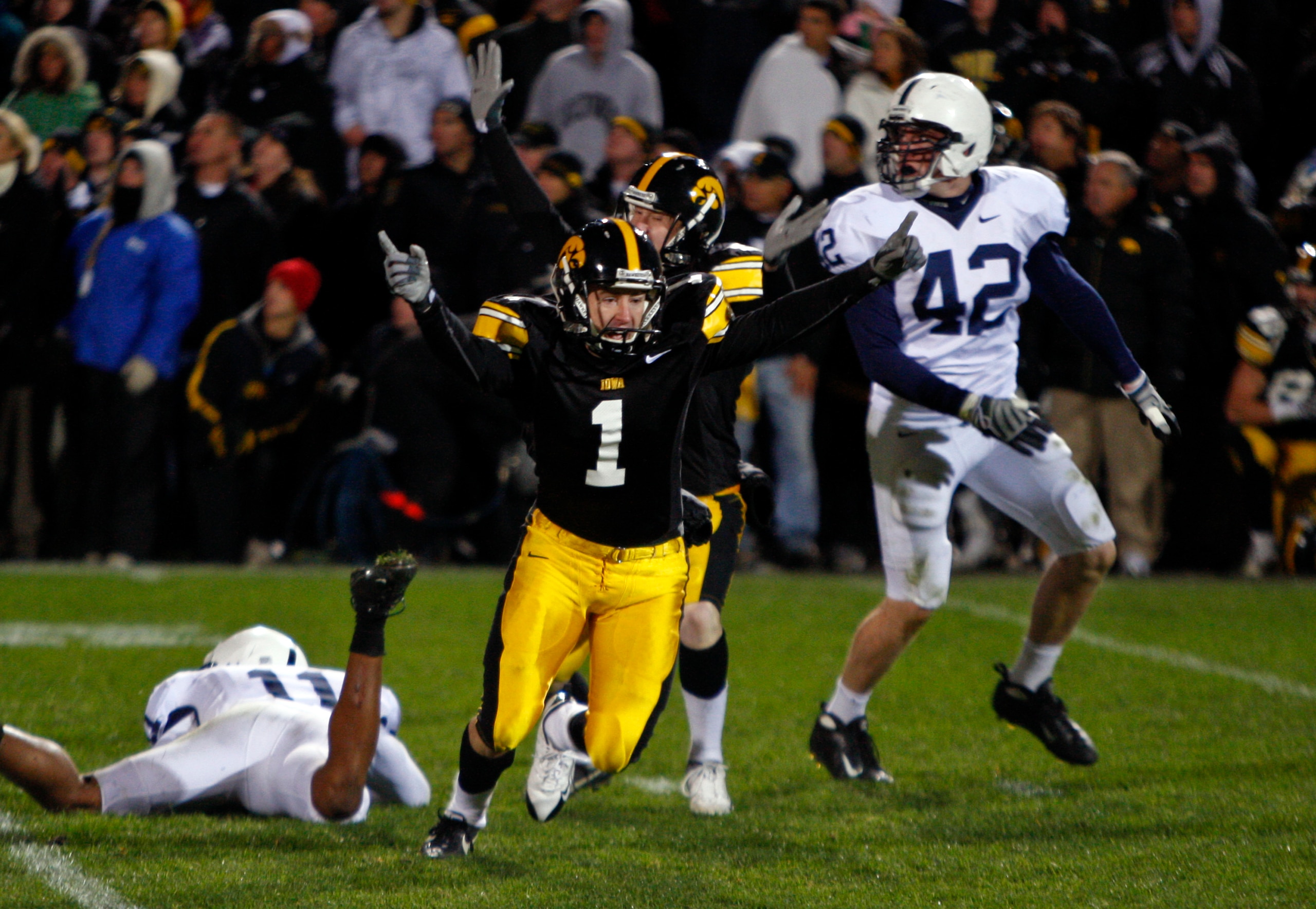 IOWA CITY, IA - NOVEMBER 8:  Iowa Kicker Daniel Murray #1 celebrates with teammate Ryan Donahue #5 after kicking the game winning field goal defeating Penn State Nittany Lions with six seconds left on the clock at Kinnick Stadium on November 8, 2008 in Io