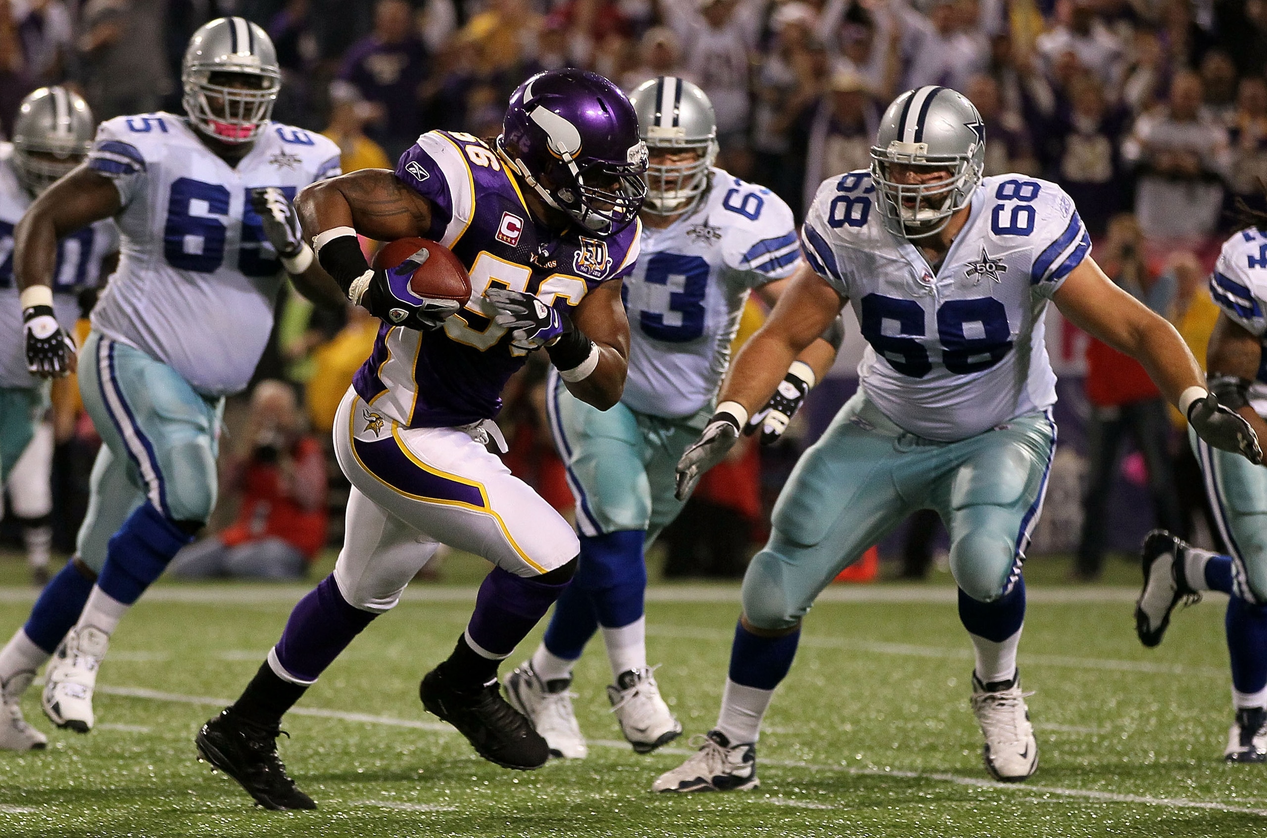 MINNEAPOLIS - OCTOBER 17:  E.J. Henderson #56 of the Minnesota Vikings intercepts a pass against the Dallas Cowboys during the game at Mall of America Field on October 17, 2010 in Minneapolis, Minnesota. The Vikings defeated the Cowboys 24-21.  (Photo by