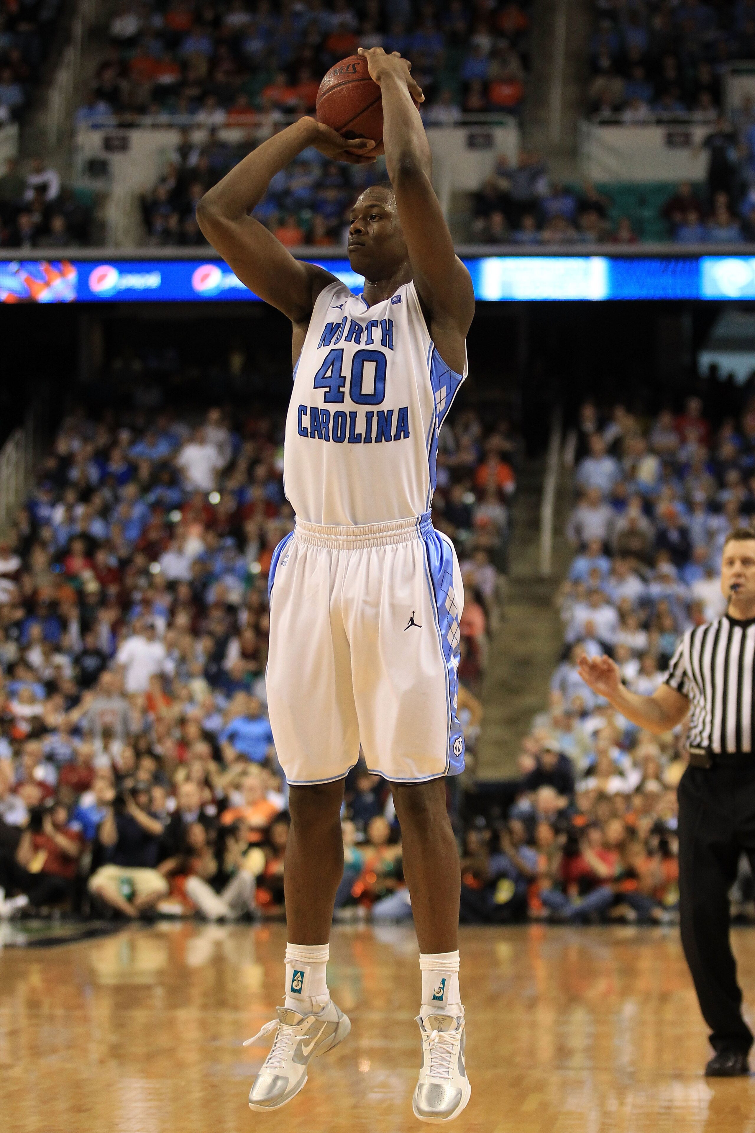 GREENSBORO, NC - MARCH 11:  Harrison Barnes #40 of the North Carolina Tar Heels shoots against the Miami Hurricanes during the second half in the quarterfinals of the 2011 ACC men's basketball tournament at the Greensboro Coliseum on March 11, 2011 in Gre