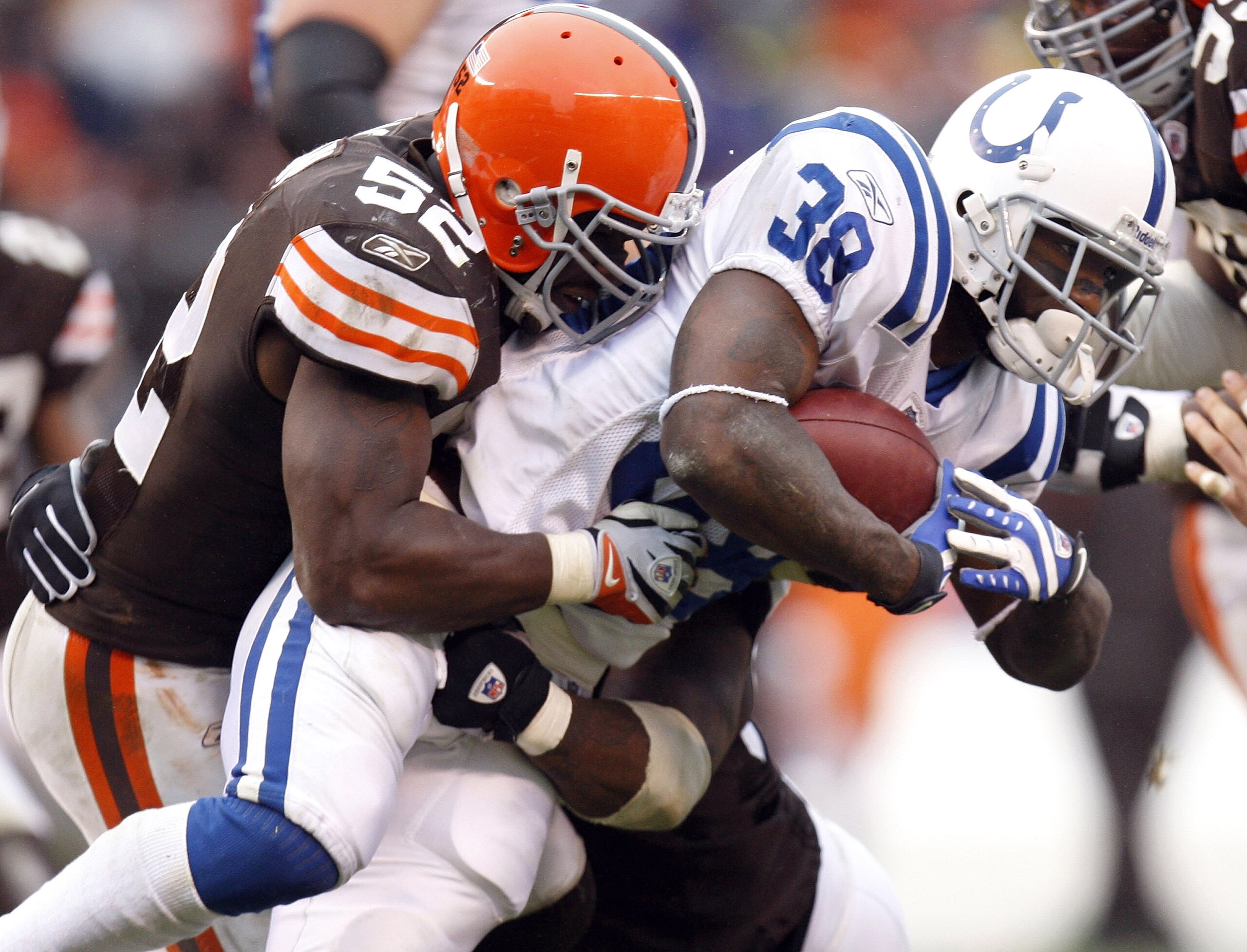 CLEVELAND - NOVEMBER 30:  Dominic Rhodes #38 of the Indianapolis Colts gets tackled by D'Qwell Jackson #52 of the Cleveland Browns during a fourth quarter run on November 30, 2008 at Cleveland Browns Stadium in Cleveland, Ohio. Indianapolis won the game 1
