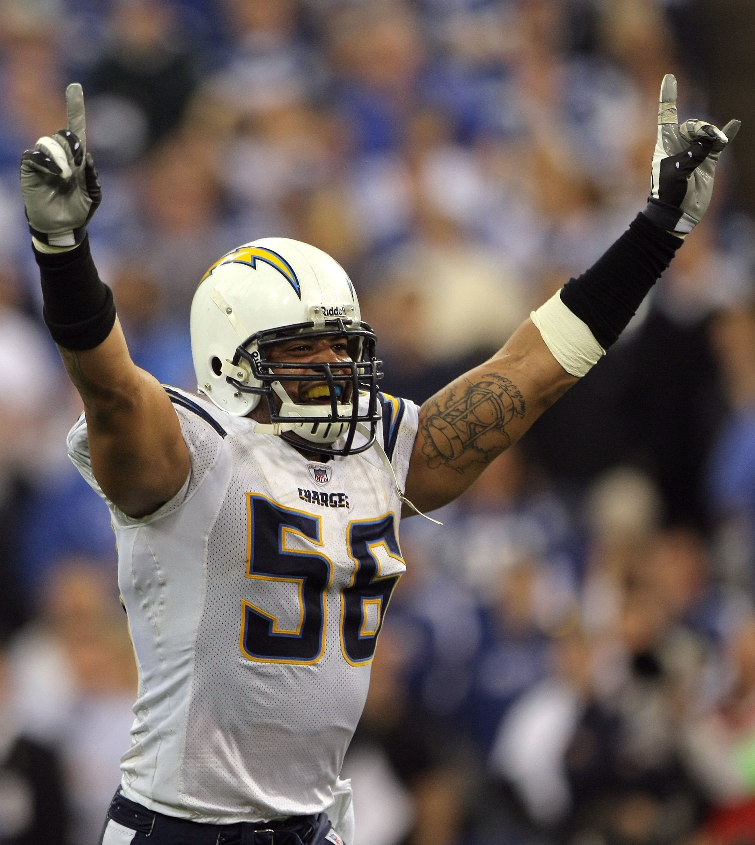 INDIANAPOLIS - JANUARY 13:  Shawne Merriman #56 of the San Diego Chargers celebrates after their 28-24 win against the Indianapolis Colts during their AFC Divisional Playoff game at the RCA Dome on January 13, 2008 in Indianapolis, Indiana.  (Photo by Dou