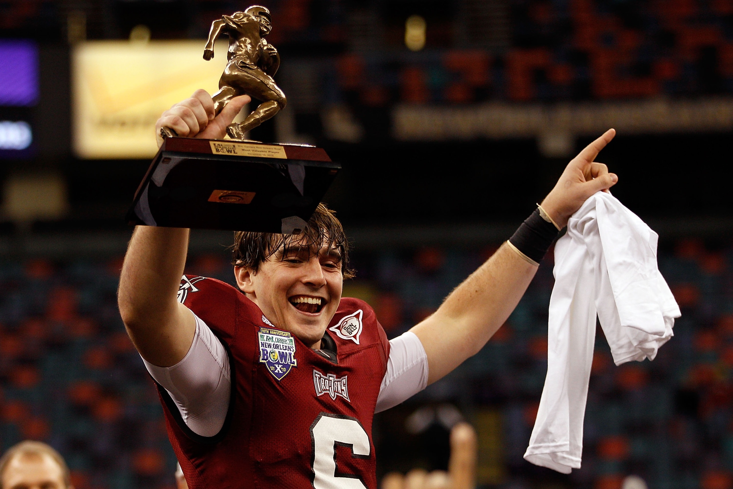 NEW ORLEANS, LA - DECEMBER 18: Corey Robinson #6 of the Troy University Trojans holds the MVP trophy after defeating the Ohio University Bobcats 48-21 during the R&L Carriers New Orleans Bowl at the Louisiana Superdome on December 18, 2010 in New Orleans NEW ORLEANS, LA - DECEMBER 18: Corey Robinson #6 of the Troy University Trojans holds the MVP trophy after defeating the Ohio University Bobcats 48-21 during the R&L Carriers New Orleans Bowl at the Louisiana Superdome on December 18, 2010 in New Orleans
