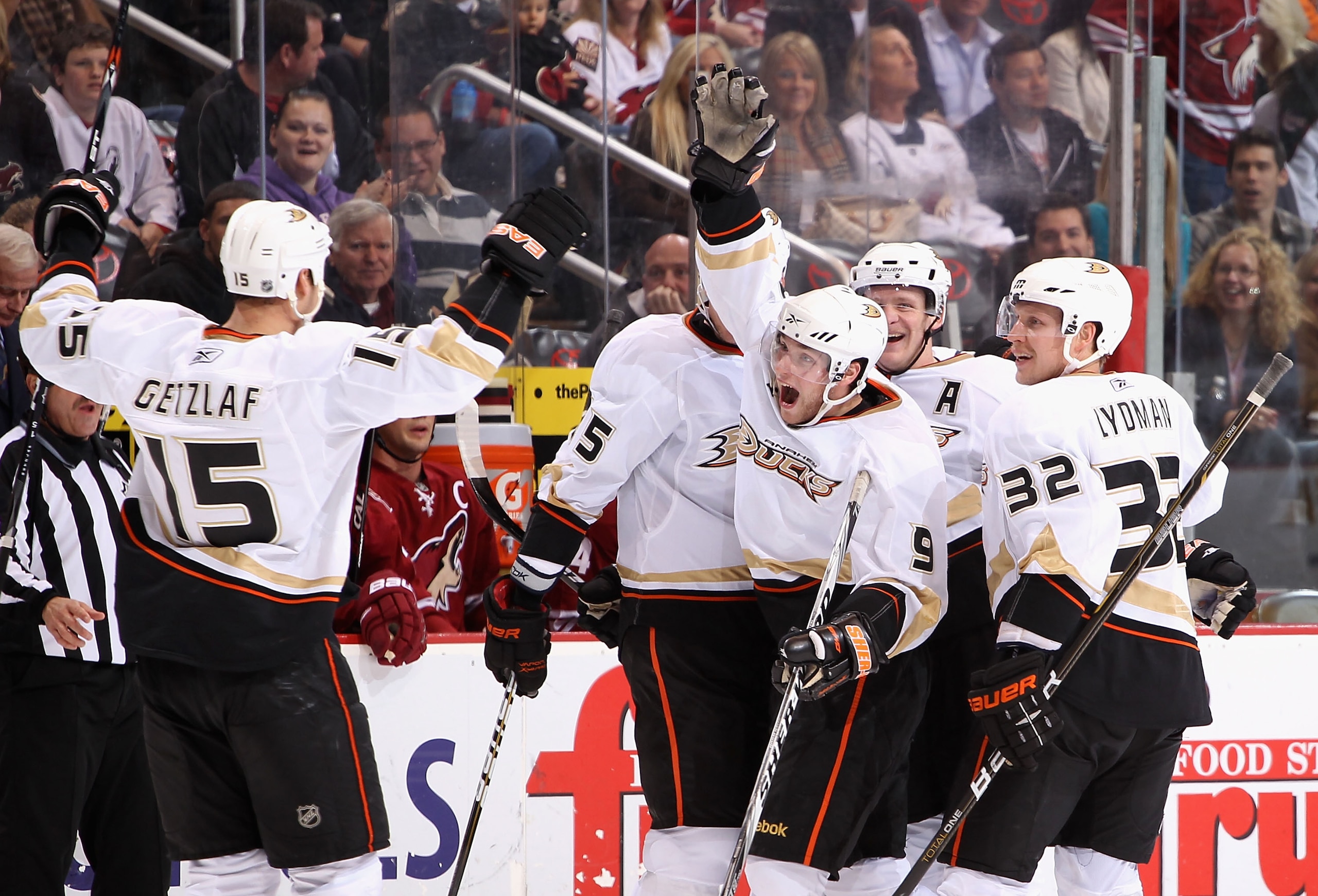 GLENDALE, AZ - NOVEMBER 27:  Bobby Ryan #9 of the Anaheim Ducks celebrates with teammates Ryan Getzlaf #15, Corey Perry #10 and Toni Lydman #32 after Ryan scored his third goal in the third period of the NHL game against the Phoenix Coyotes at Jobing.com