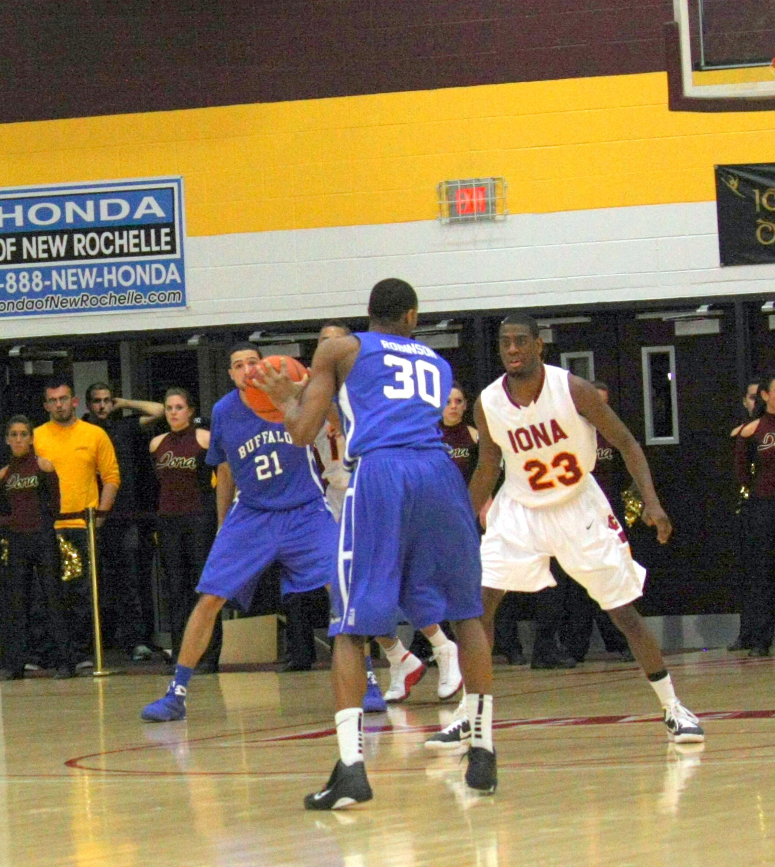 Randy Dezouvre guards Titus Robinson