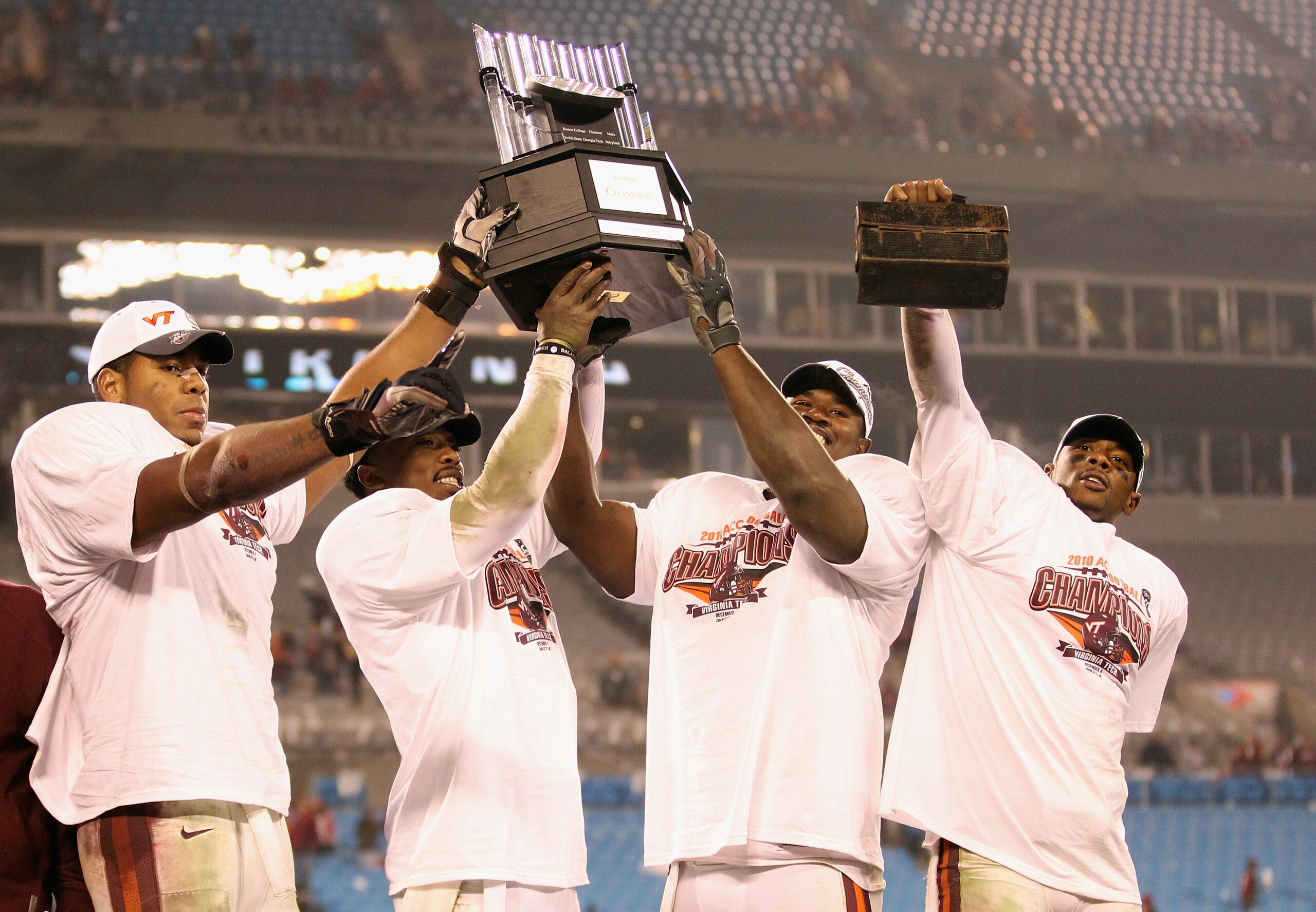 CHARLOTTE, NC - DECEMBER 04: Teammates Andre Smith #88, Tyrod Taylor #5, John Graves #91 and Davon Morgan #2 of the Virginia Tech Hokies celebrate after winning the ACC Championship 44-33 after their game at Bank of America Stadium on December 4, 2010 in CHARLOTTE, NC - DECEMBER 04: Teammates Andre Smith #88, Tyrod Taylor #5, John Graves #91 and Davon Morgan #2 of the Virginia Tech Hokies celebrate after winning the ACC Championship 44-33 after their game at Bank of America Stadium on December 4, 2010 in