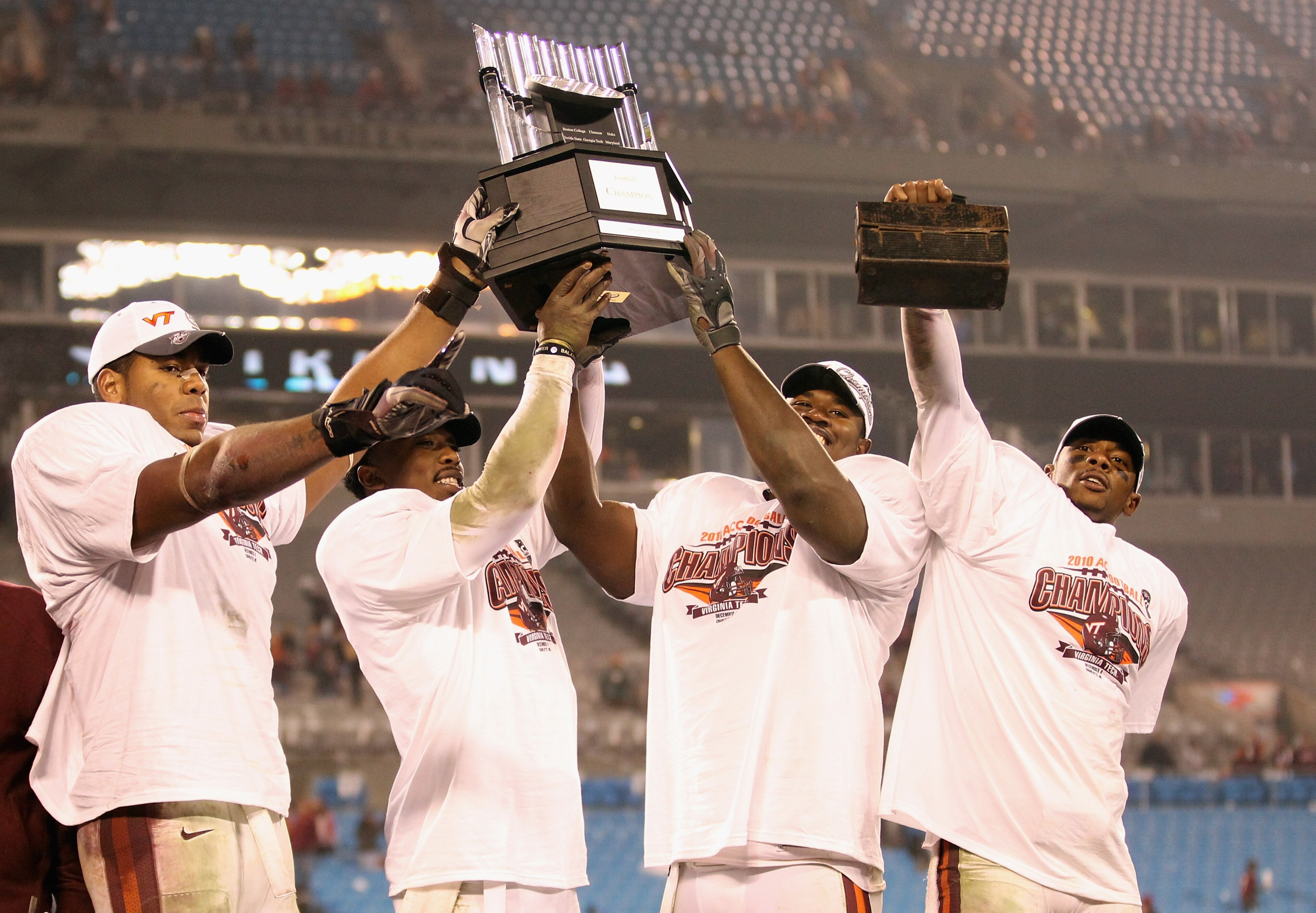 CHARLOTTE, NC - DECEMBER 04: Teammates Andre Smith #88, Tyrod Taylor #5, John Graves #91 and Davon Morgan #2 of the Virginia Tech Hokies celebrate after winning the ACC Championship 44-33 after their game at Bank of America Stadium on December 4, 2010 in CHARLOTTE, NC - DECEMBER 04: Teammates Andre Smith #88, Tyrod Taylor #5, John Graves #91 and Davon Morgan #2 of the Virginia Tech Hokies celebrate after winning the ACC Championship 44-33 after their game at Bank of America Stadium on December 4, 2010 in