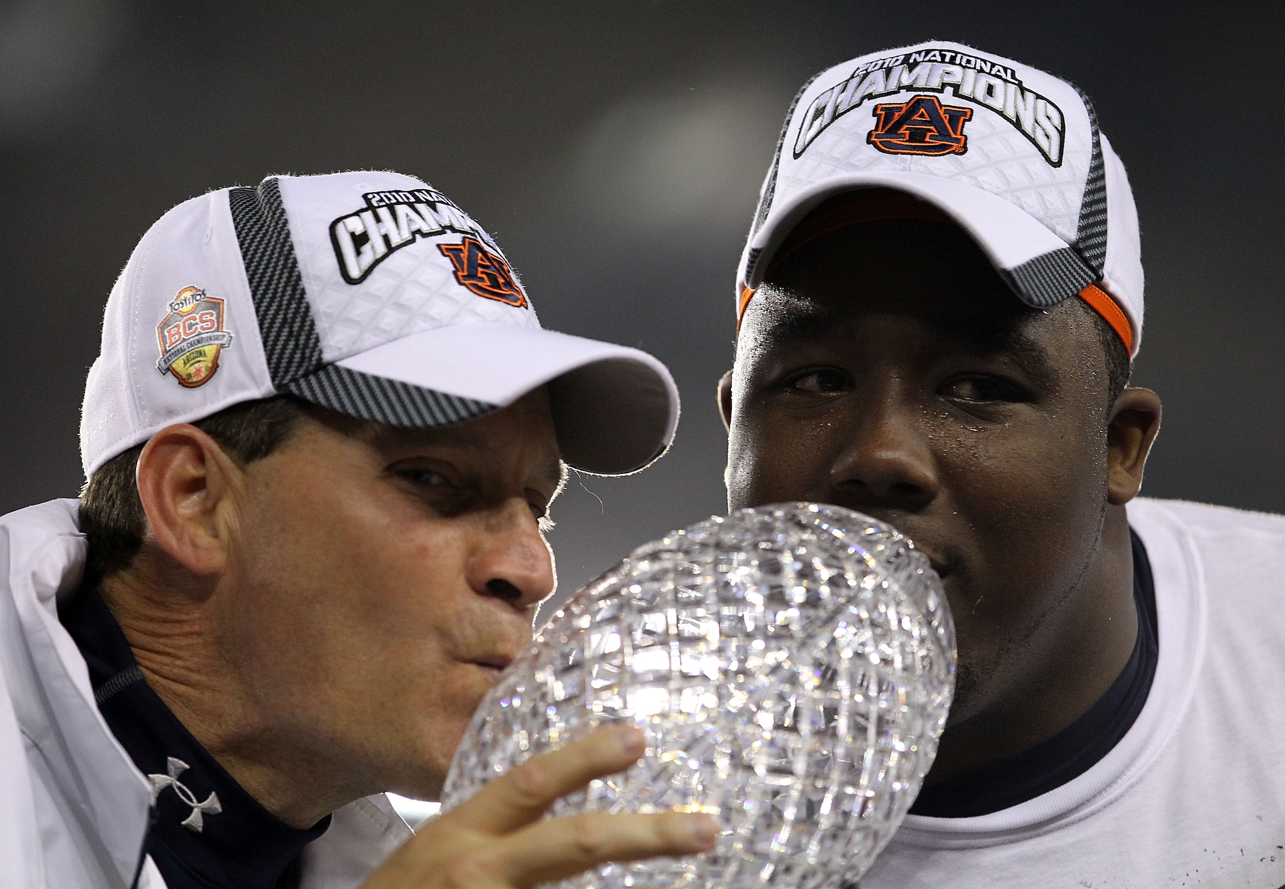 GLENDALE, AZ - JANUARY 10: Head coach Gene Chizik and Nick Fairley #90 of the Auburn Tigers celebrate the Tigers 22-19 victory against the Oregon Ducks during the Tostitos BCS National Championship Game at University of Phoenix Stadium on January 10, 201 GLENDALE, AZ - JANUARY 10: Head coach Gene Chizik and Nick Fairley #90 of the Auburn Tigers celebrate the Tigers 22-19 victory against the Oregon Ducks during the Tostitos BCS National Championship Game at University of Phoenix Stadium on January 10, 201