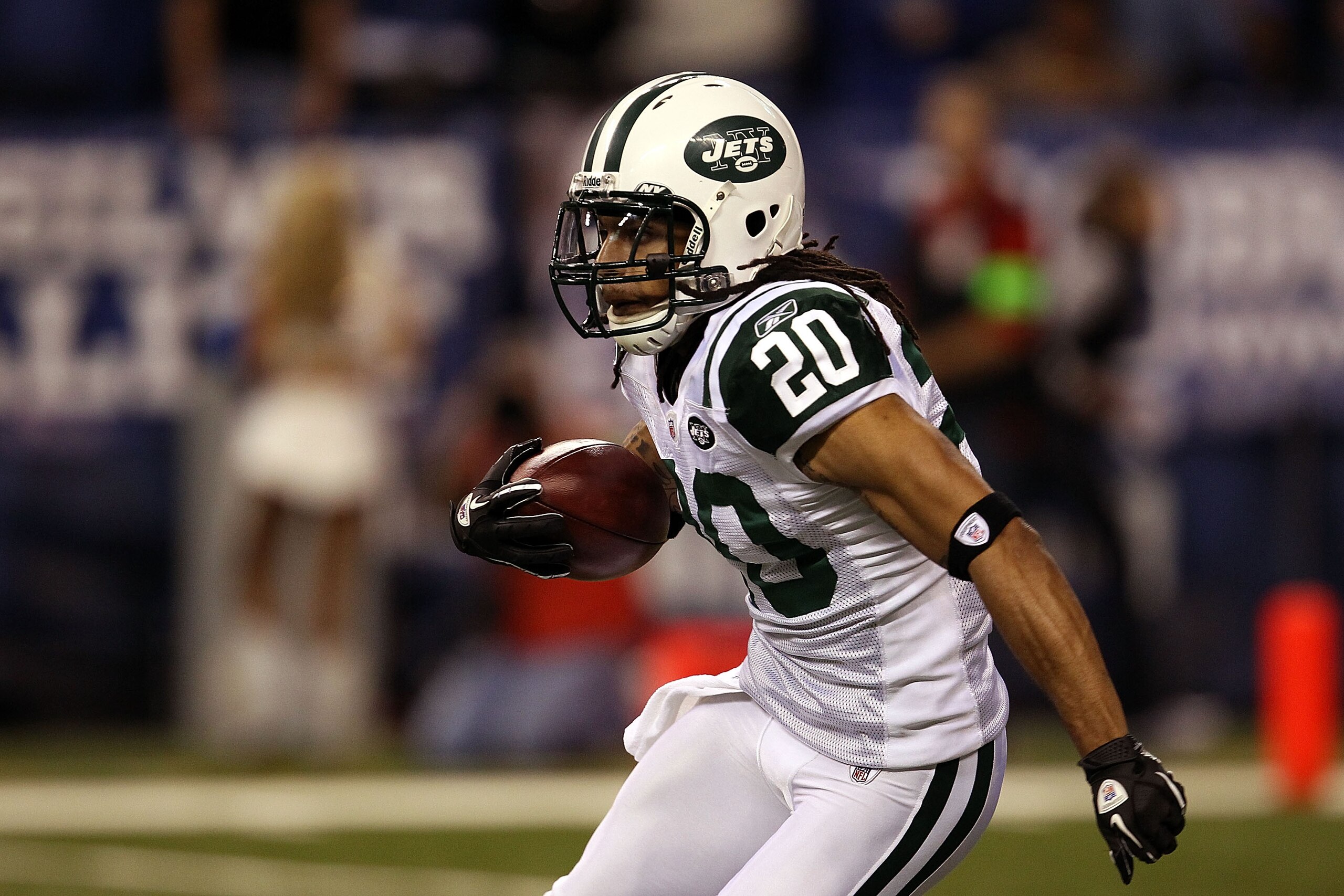 INDIANAPOLIS, IN - JANUARY 08:  Kyle Wilson #20 of the New York Jets returns a kickoff against the Indianapolis Colts during their 2011 AFC wild card playoff game at Lucas Oil Stadium on January 8, 2011 in Indianapolis, Indiana. The Jets won 17-16.  (Phot