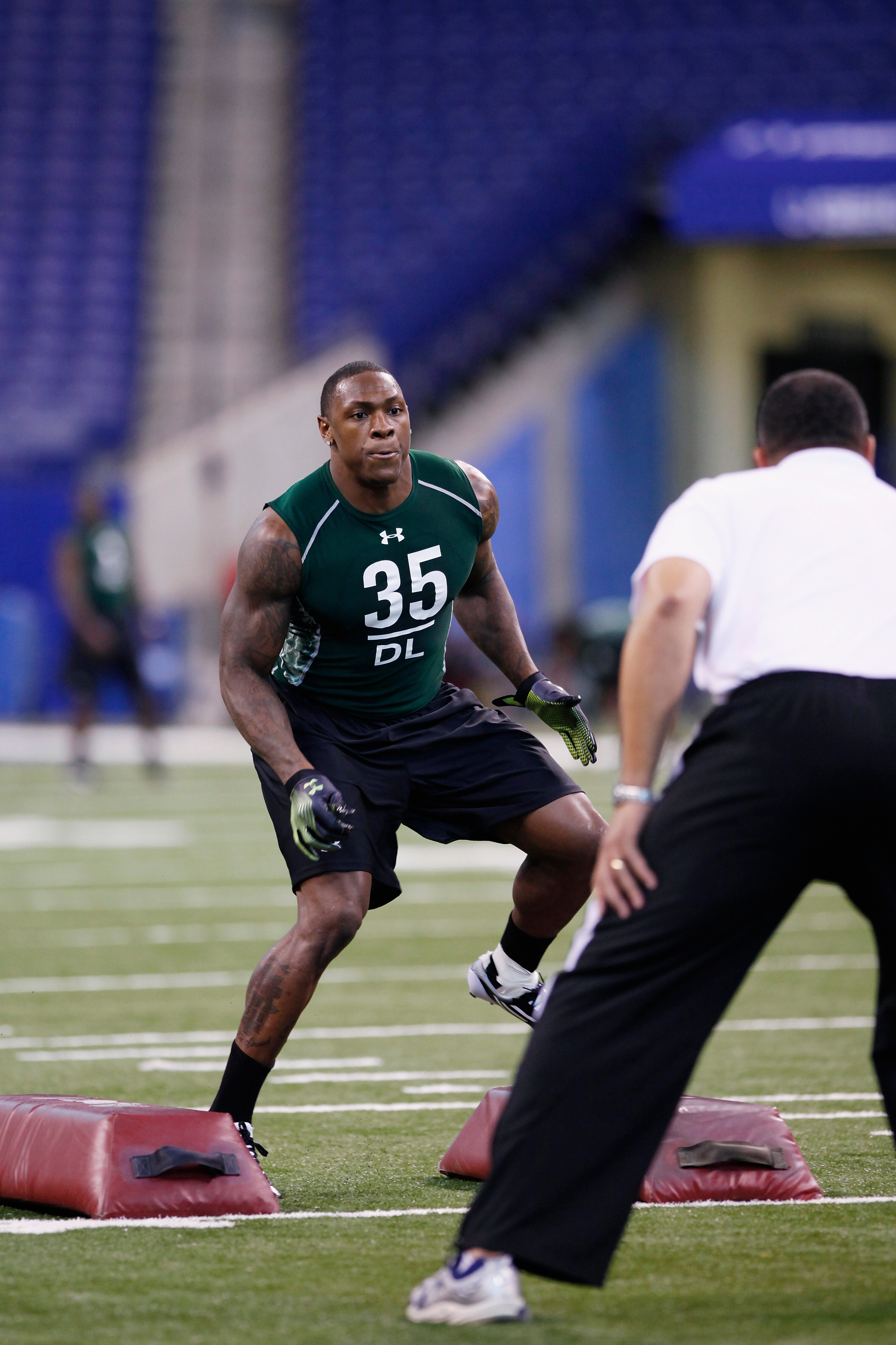 INDIANAPOLIS, IN - FEBRUARY 28: Defensive lineman Dontay Moch of Nevada runs a drill during the 2011 NFL Scouting Combine at Lucas Oil Stadium on February 28, 2011 in Indianapolis, Indiana. (Photo by Joe Robbins/Getty Images)