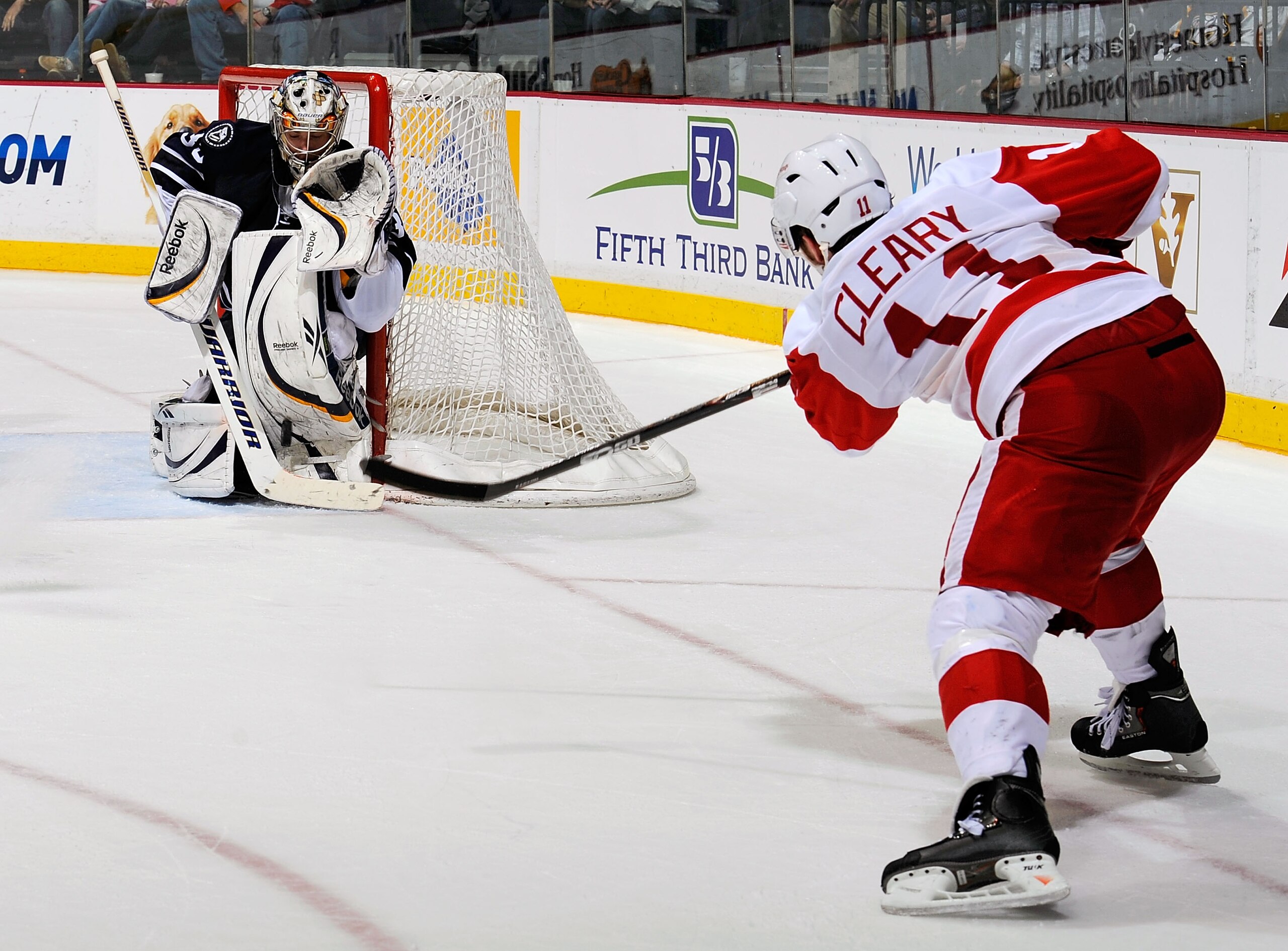 NASHVILLE, TN - MARCH 19:  Danny Cleary #11 of the Detroit Red Wings takes a shot on Pekka Rinne #35 of the Nashville Predators on March 19, 2011 at the Bridgestone Arena in Nashville, Tennessee.  (Photo by Frederick Breedon/Getty Images)
