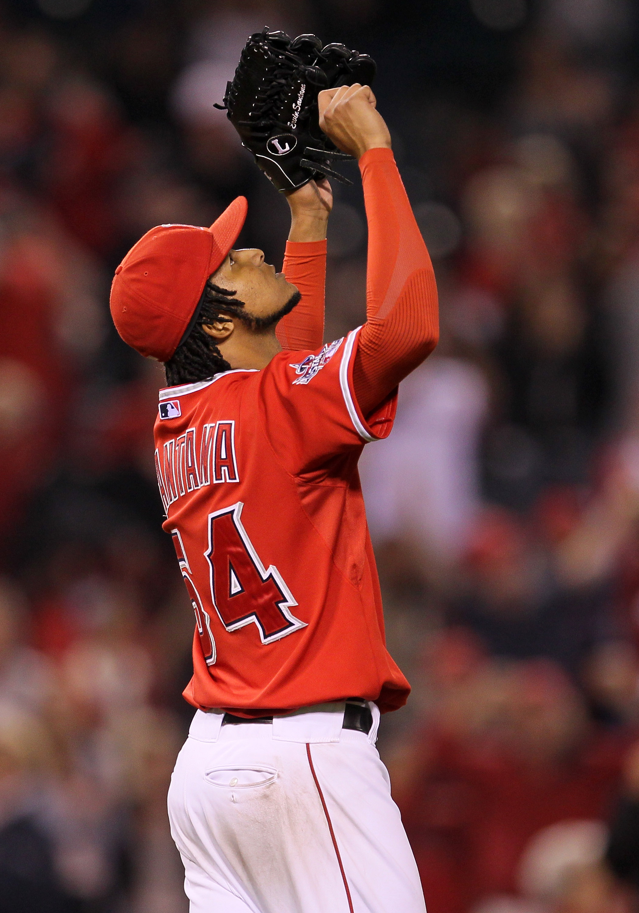 ANAHEIM, CA - SEPTEMBER 21:  Ervin Santana #54 of the Los Angeles Angels of Anaheim celebrates after getting the final out of his complete game shutout against the Texas Rangers on September 21, 2010 at Angel Stadium in Anaheim, California. The Angels won