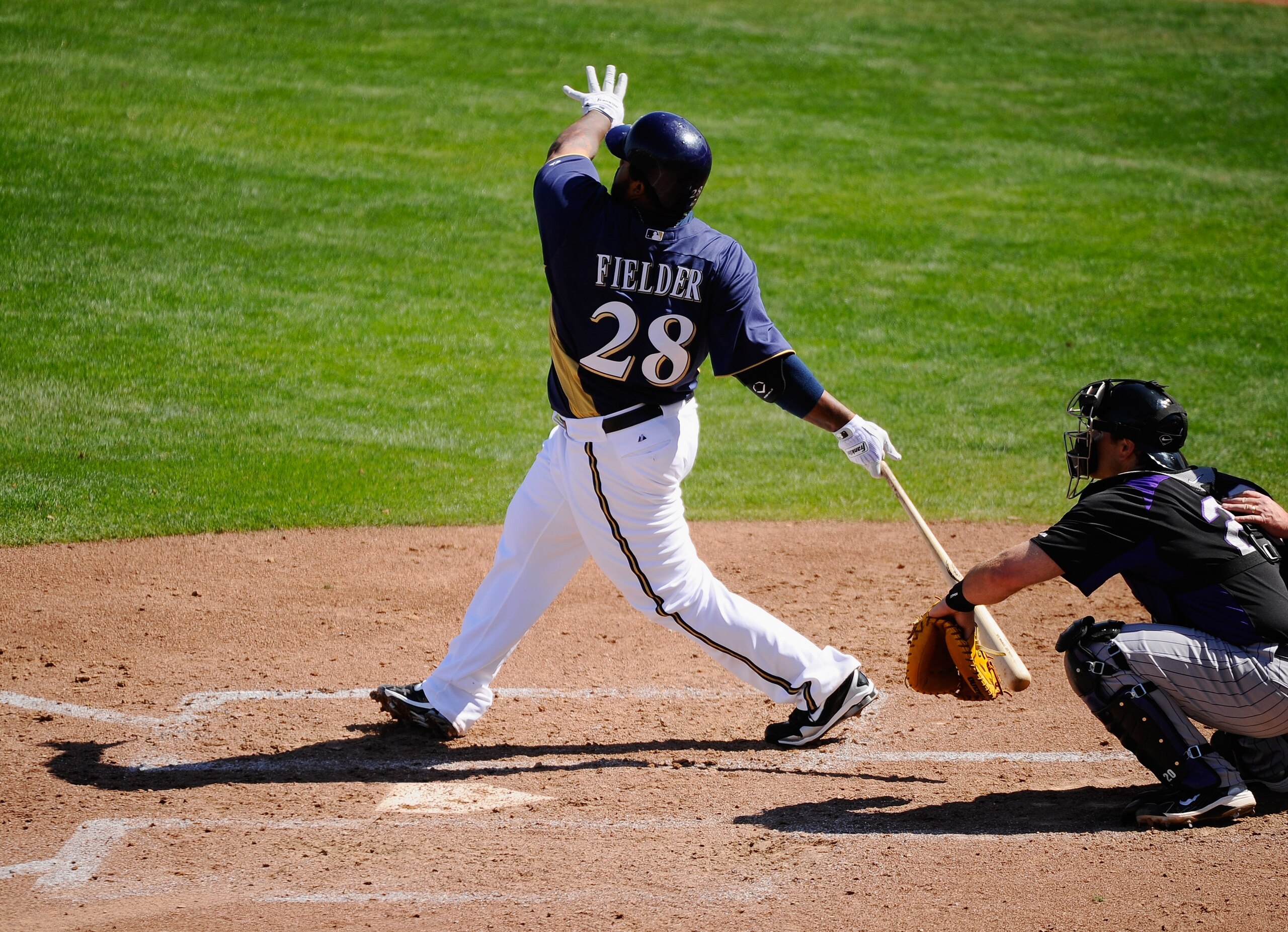 PHOENIX, AZ - MARCH 10:  Prince Fielder#28 of the Milwaukee Brewers hits a base hit against the Colorado Rockies in the third inning of the spring training baseball game at Maryvale Baseball Park on March 10, 2011 in Phoenix, Arizona.  (Photo by Kevork Dj