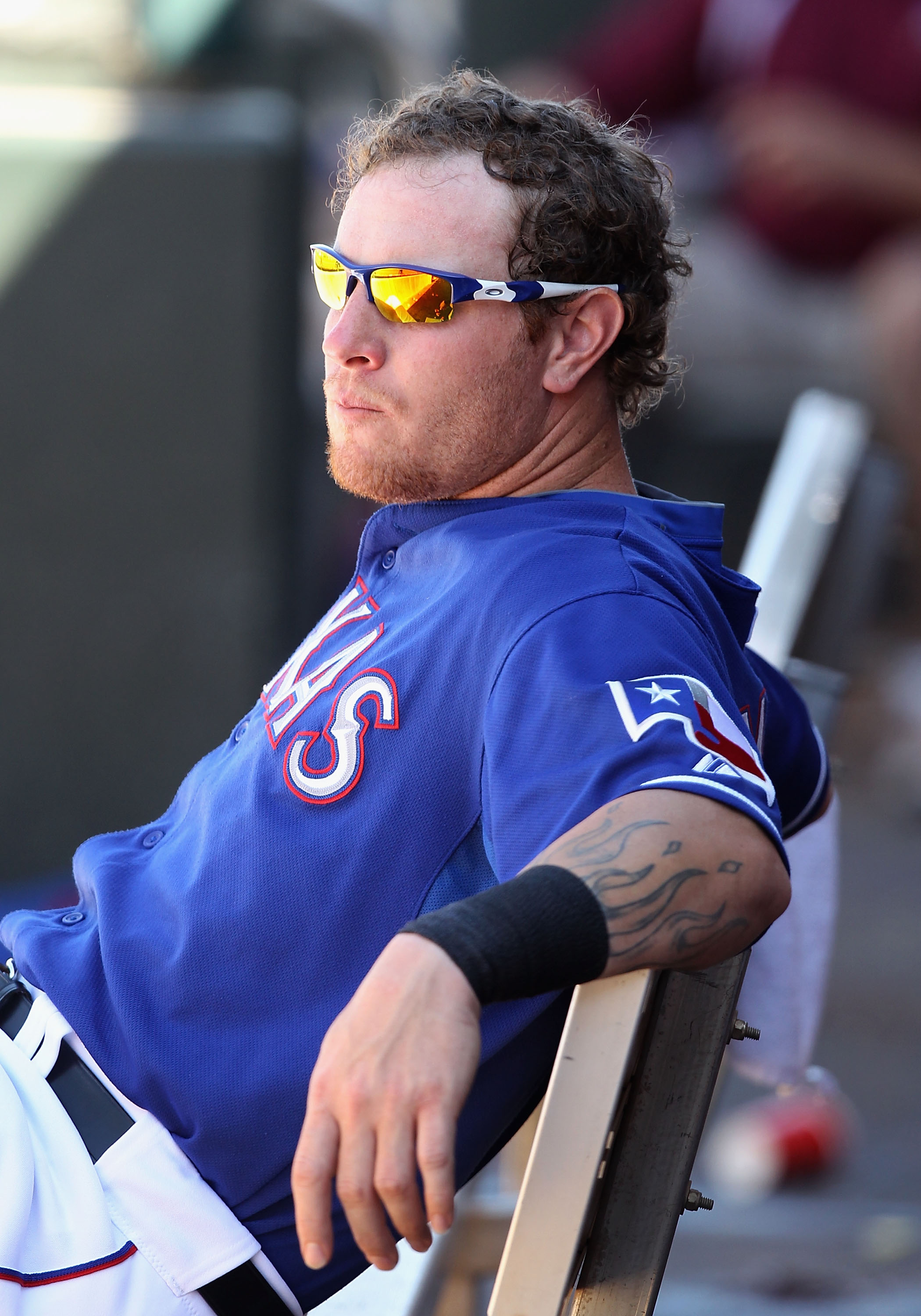 SURPRISE, AZ - MARCH 11:  Josh Hamilton #32 of the Texas Rangers sits in the dugout during the spring training game against the Cincinnati Reds at Surprise Stadium on March 11, 2011 in Surprise, Arizona.  (Photo by Christian Petersen/Getty Images)