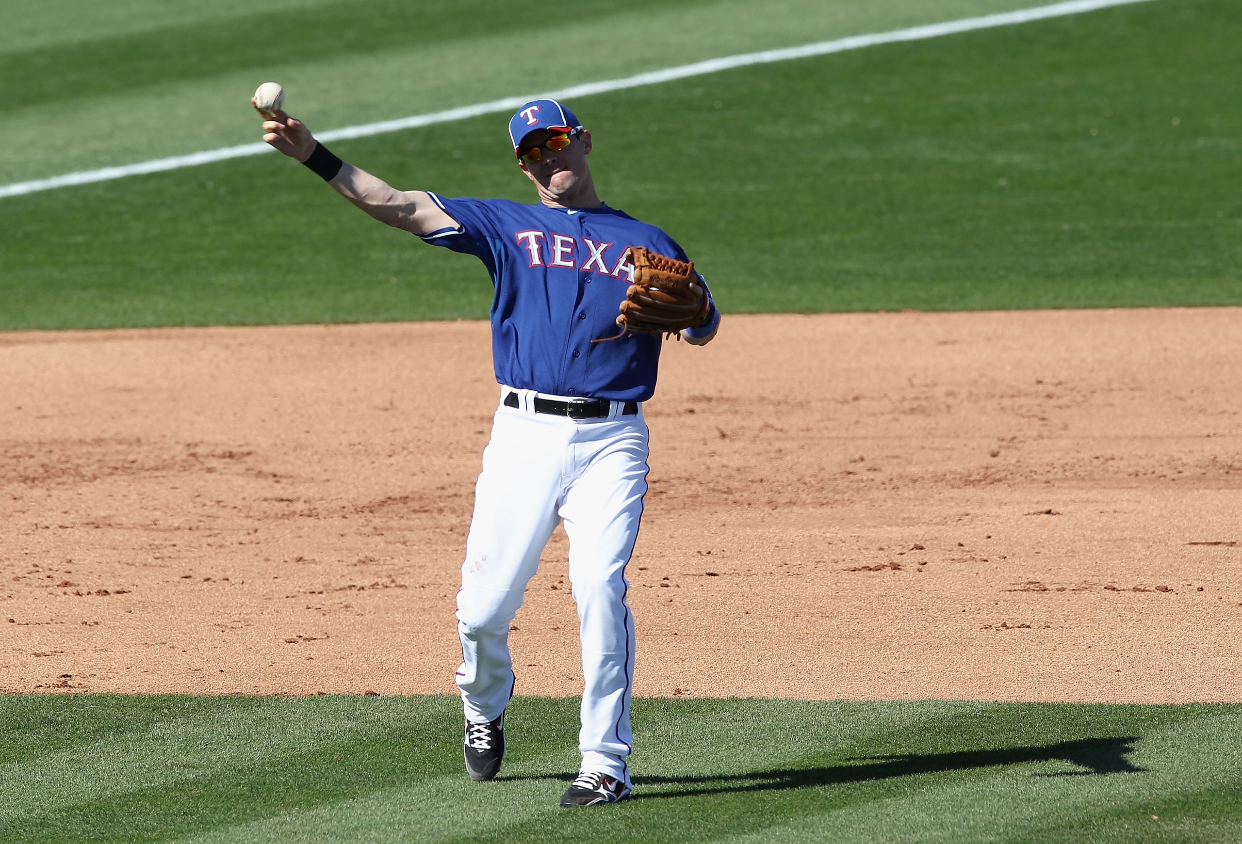 SURPRISE, AZ - MARCH 02:  Infielder Michael Young #10 of the Texas Rangers during the spring training game against the Los Angeles Angels of Anaheim at Surprise Stadium on March 2, 2011 in Surprise, Arizona.  (Photo by Christian Petersen/Getty Images)