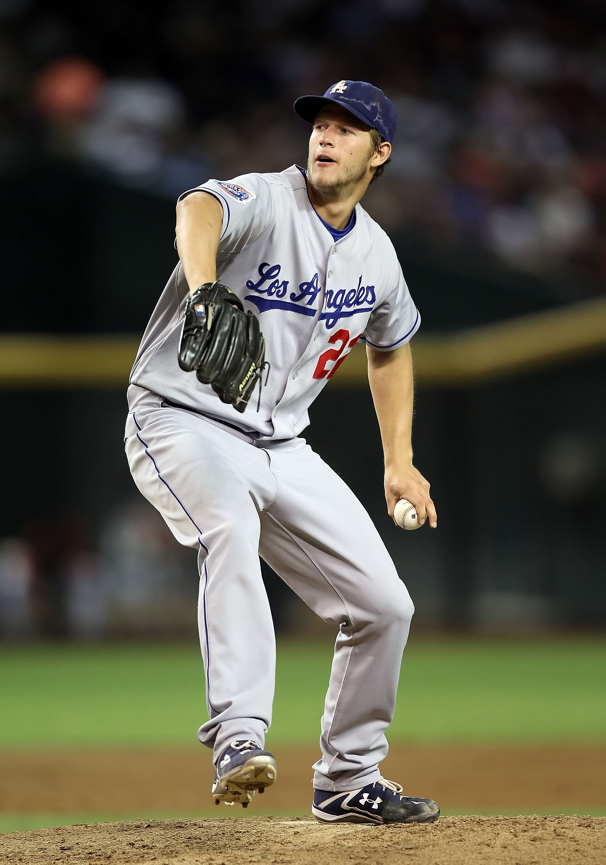 PHOENIX - SEPTEMBER 24:  Starting pitcher Clayton Kershaw #22 of the Los Angeles Dodgers pitches against the Arizona Diamondbacks during the Major League Baseball game at Chase Field on September 24, 2010 in Phoenix, Arizona.  (Photo by Christian Petersen