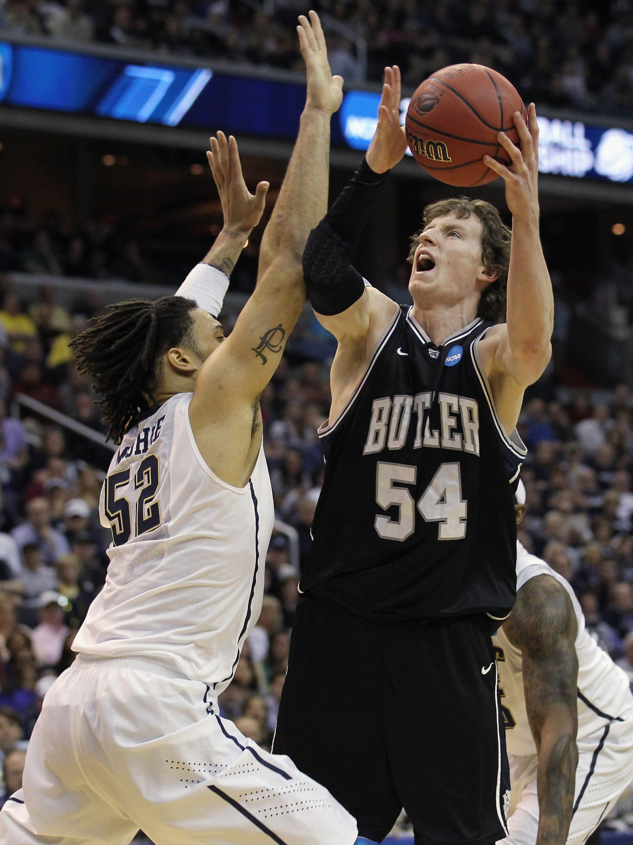 WASHINGTON - MARCH 19:  Matt Howard #54 of the Butler Bulldogs puts up a shot against Gary McGhee #52 of the Pittsburgh Panthers during the third round of the 2011 NCAA men's basketball tournament at Verizon Center on March 19, 2011 in Washington, DC.  (P