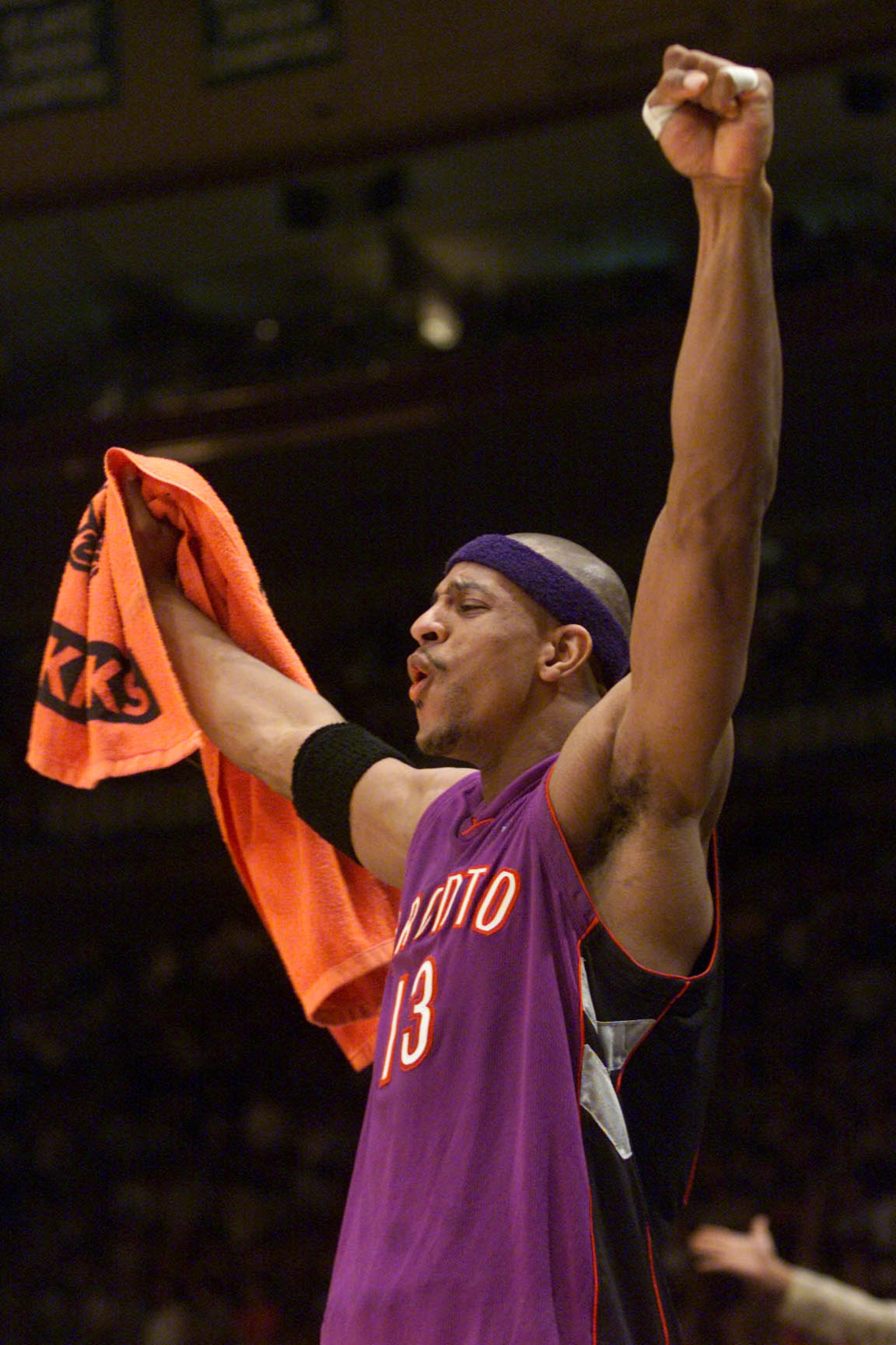 4 May 2001:  Jerome Williams #13 of the Toronto Raptors celebrates in game four of round one of the NBA playoffs against the New York Knicks at Madison Square Garden in New York, New York.  The Raptors won 93-89 to take the series 3-2.  DIGITAL IMAGE.  Ma