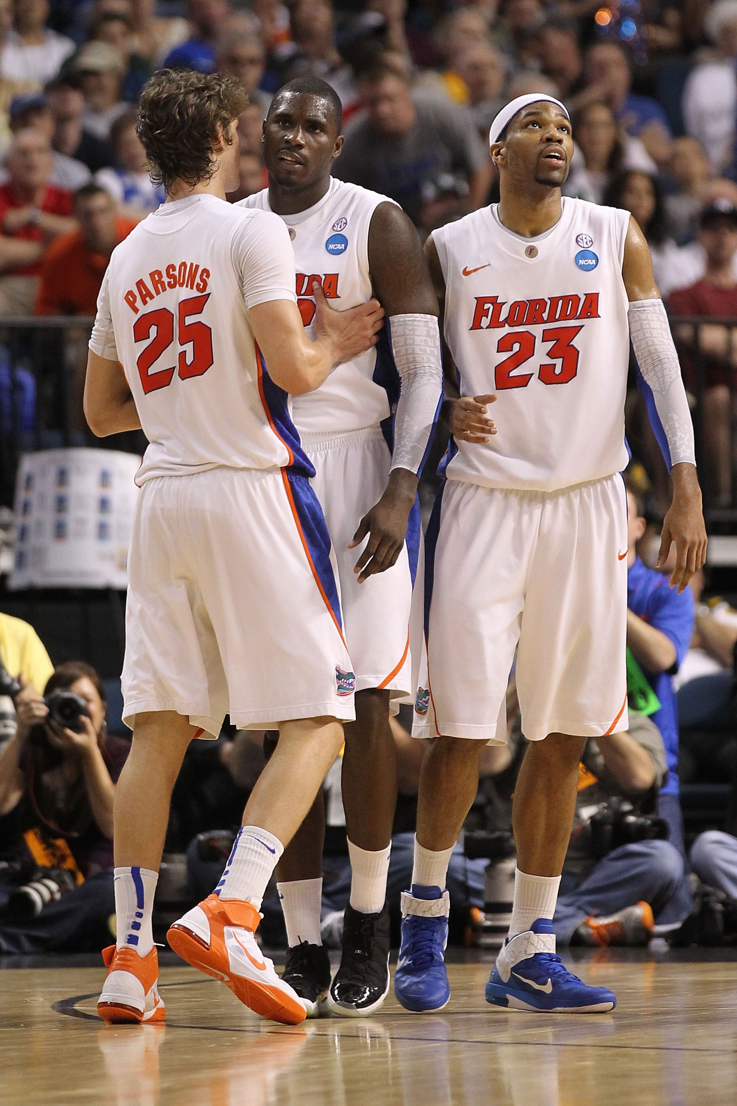TAMPA, FL - MARCH 19:  (L-R) Chandler Parsons #25 , Vernon Macklin #32 and Alex Tyus #23 of the Florida Gators stand on court against the UCLA Bruins during the third round of the 2011 NCAA men's basketball tournament at St. Pete Times Forum on March 19,
