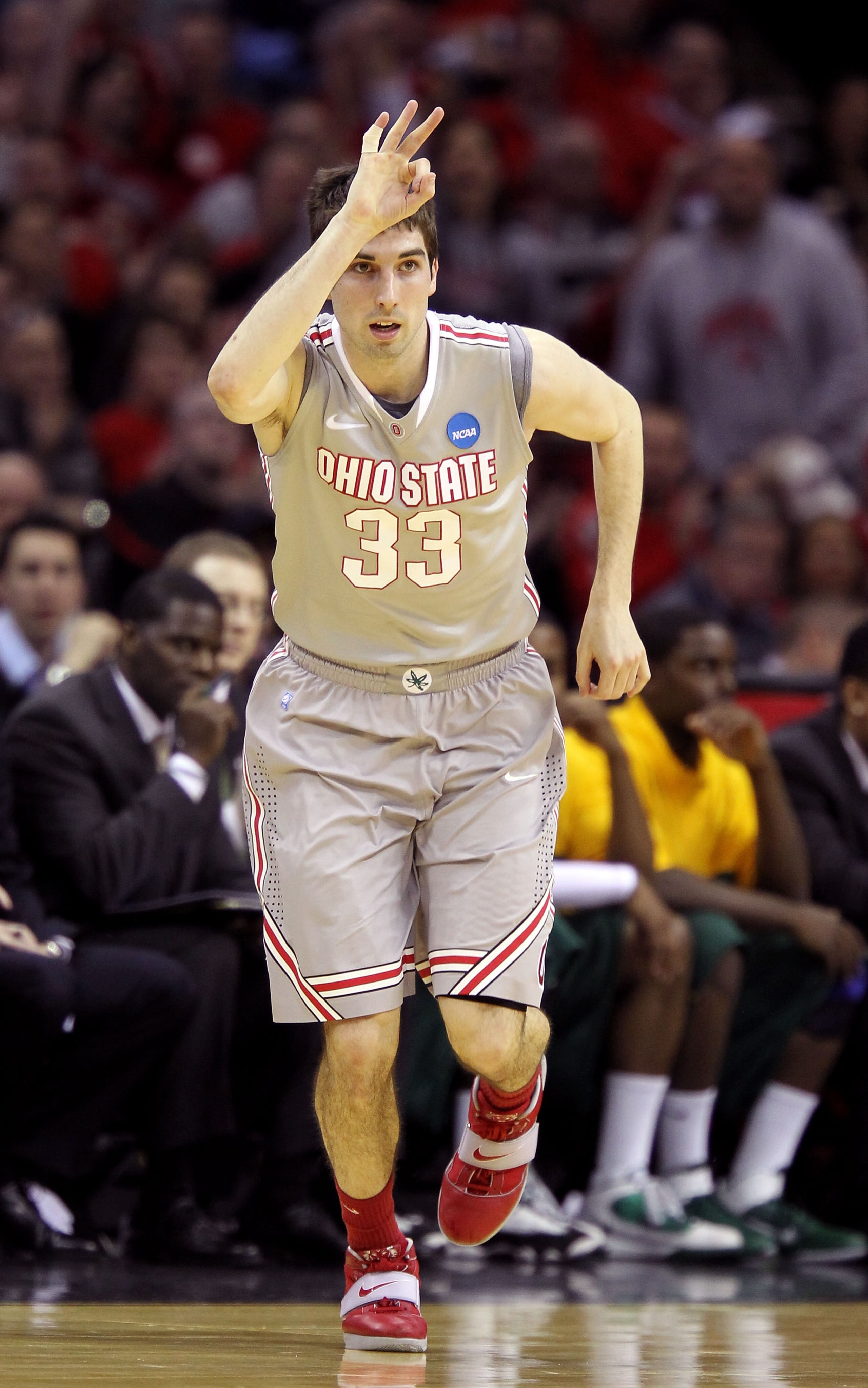 CLEVELAND, OH - MARCH 20: Jon Diebler #33 of the Ohio State Buckeyes gestures after making a three point basket during the first half against the George Mason Patriots during the third of the 2011 NCAA men's basketball tournament at Quicken Loans Arena on
