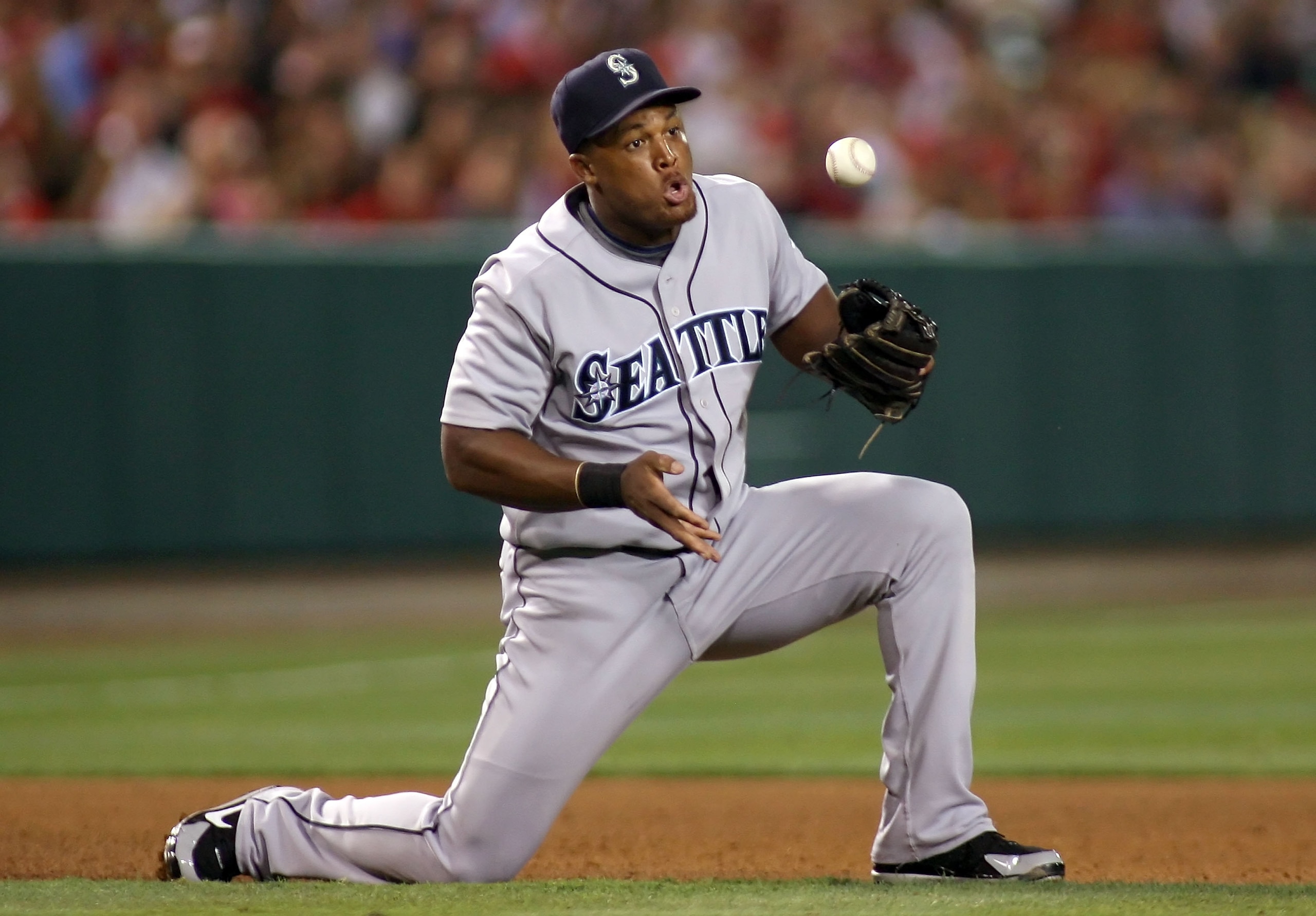 ANAHEIM, CA - AUGUST 12: Adrian Beltre #29 of the Seattle Mariners bobbles the ball on a grounder against the Los Angeles Angels of Anaheim at Angel Stadium on August 12, 2008 in Anaheim, California. The Angels defeated the Mariners 7-3. (Photo by Christi