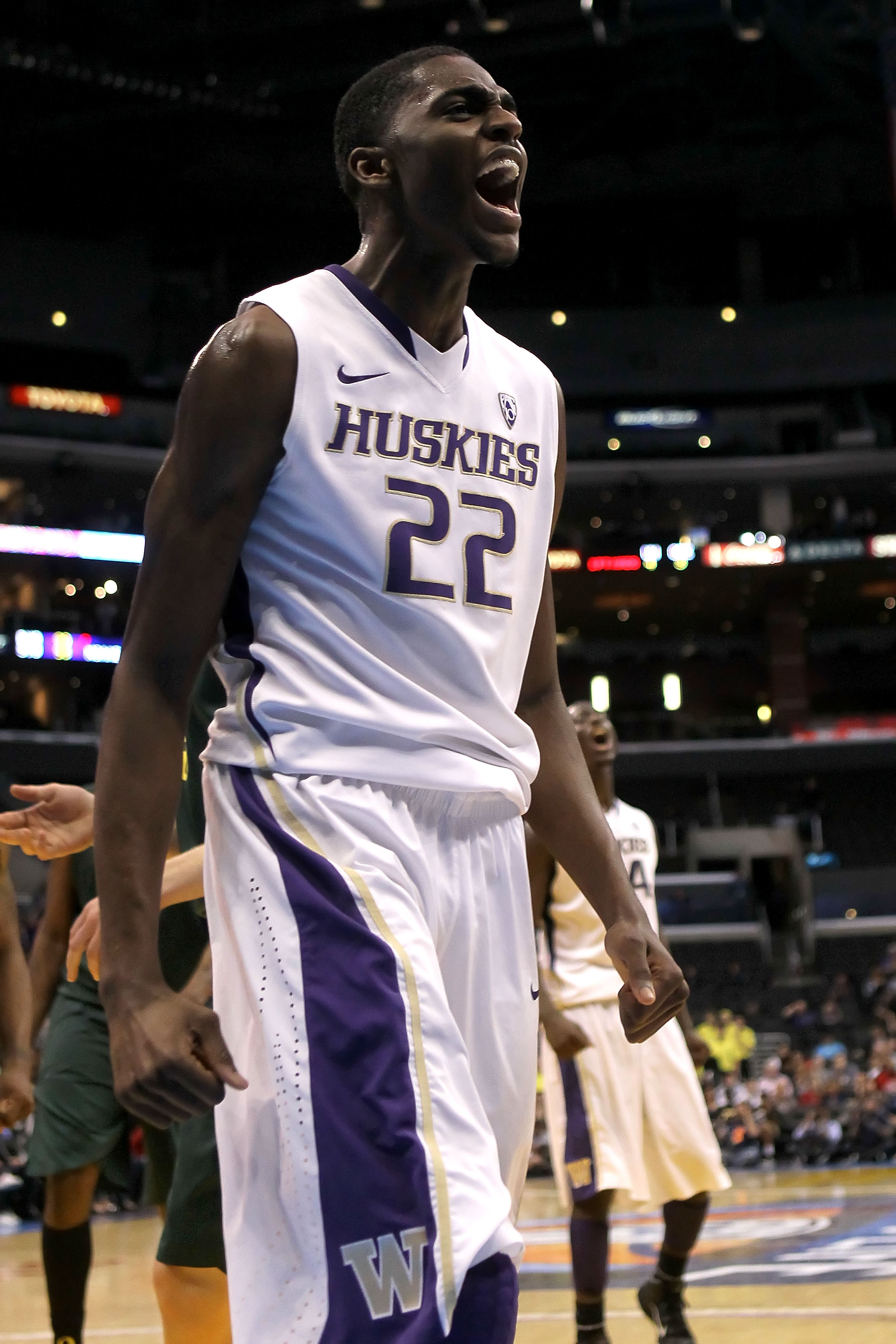 LOS ANGELES, CA - MARCH 11: Justin Holiday #22 of the Washington Huskies reacts in the second half while taking on the Oregon Ducks in the semifinals of the 2011 Pacific Life Pac-10 Men's Basketball Tournament at Staples Center on March 11, 2011 in Los A