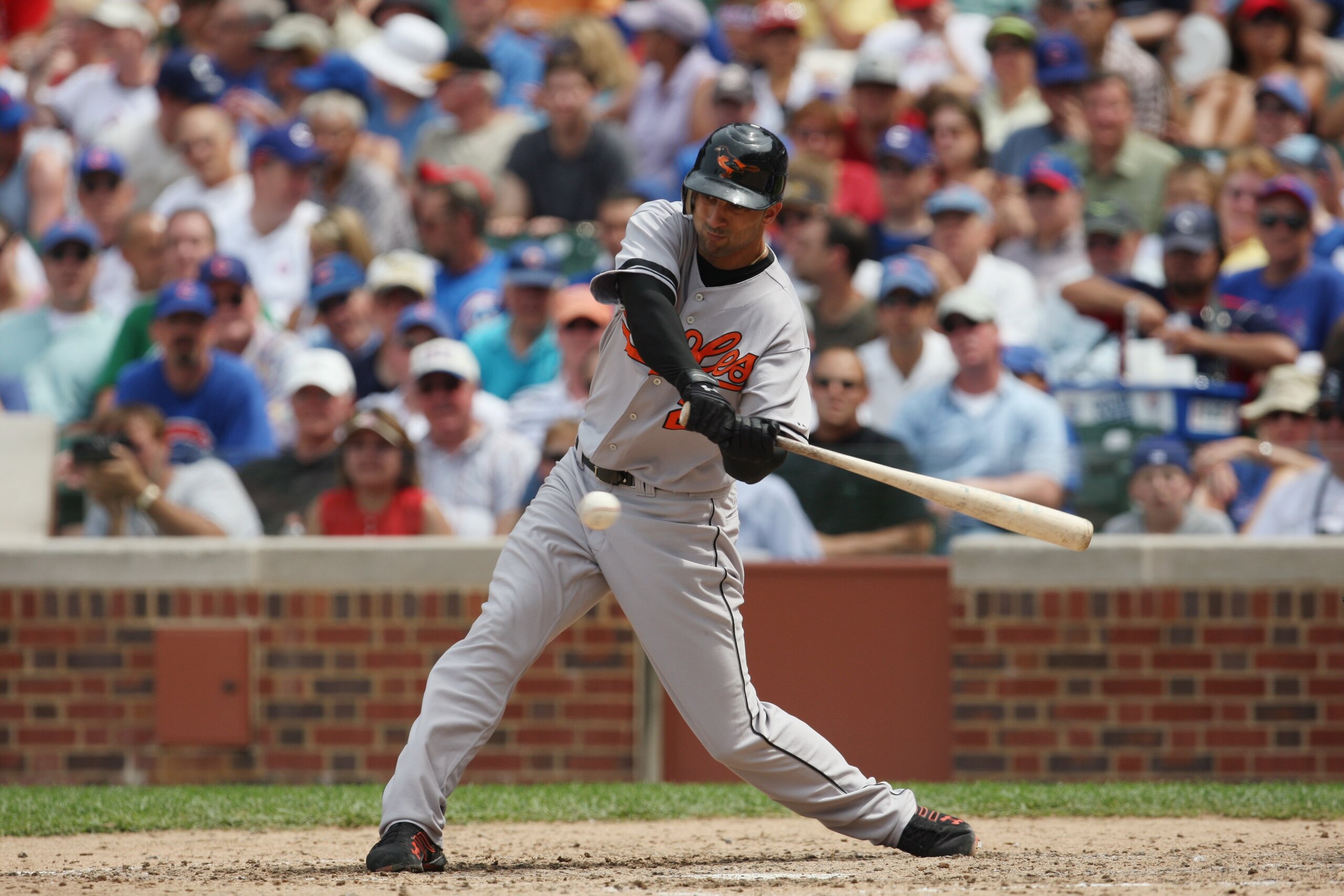 CHICAGO - JUNE 26: Nick Markakis #21 of the Baltimore Orioles swings at a pitch against the Chicago Cubs during the MLB game on June 26, 2008 at Wrigley Field in Chicago, Illinois. (Photo by Jonathan Daniel/Getty Images)