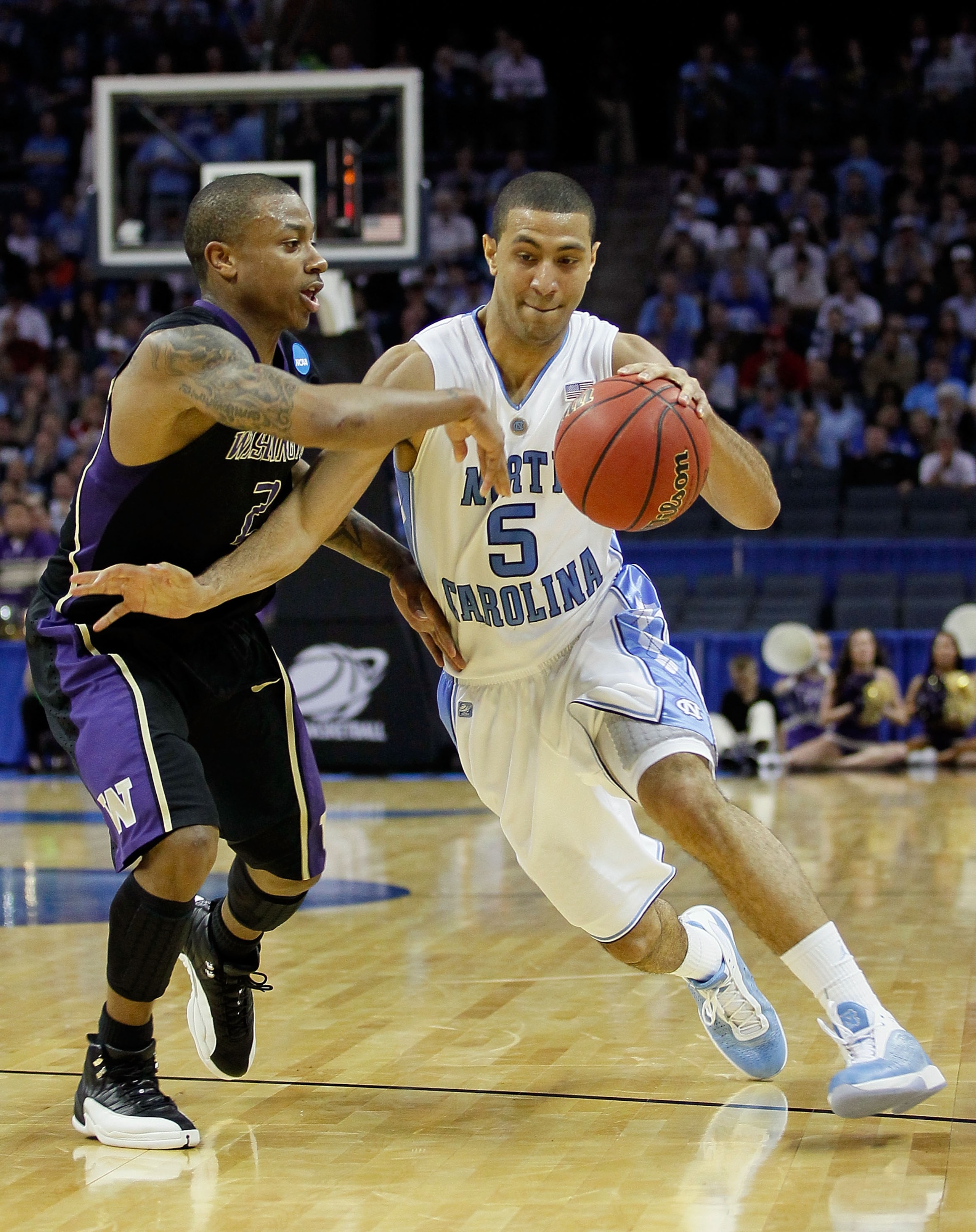 CHARLOTTE, NC - MARCH 20:  Kendall Marshall #5 of the North Carolina Tar Heels drives on Isaiah Thomas #2 of the Washington Huskies during the third round of the 2011 NCAA men's basketball tournament at Time Warner Cable Arena on March 20, 2011 in Charlot