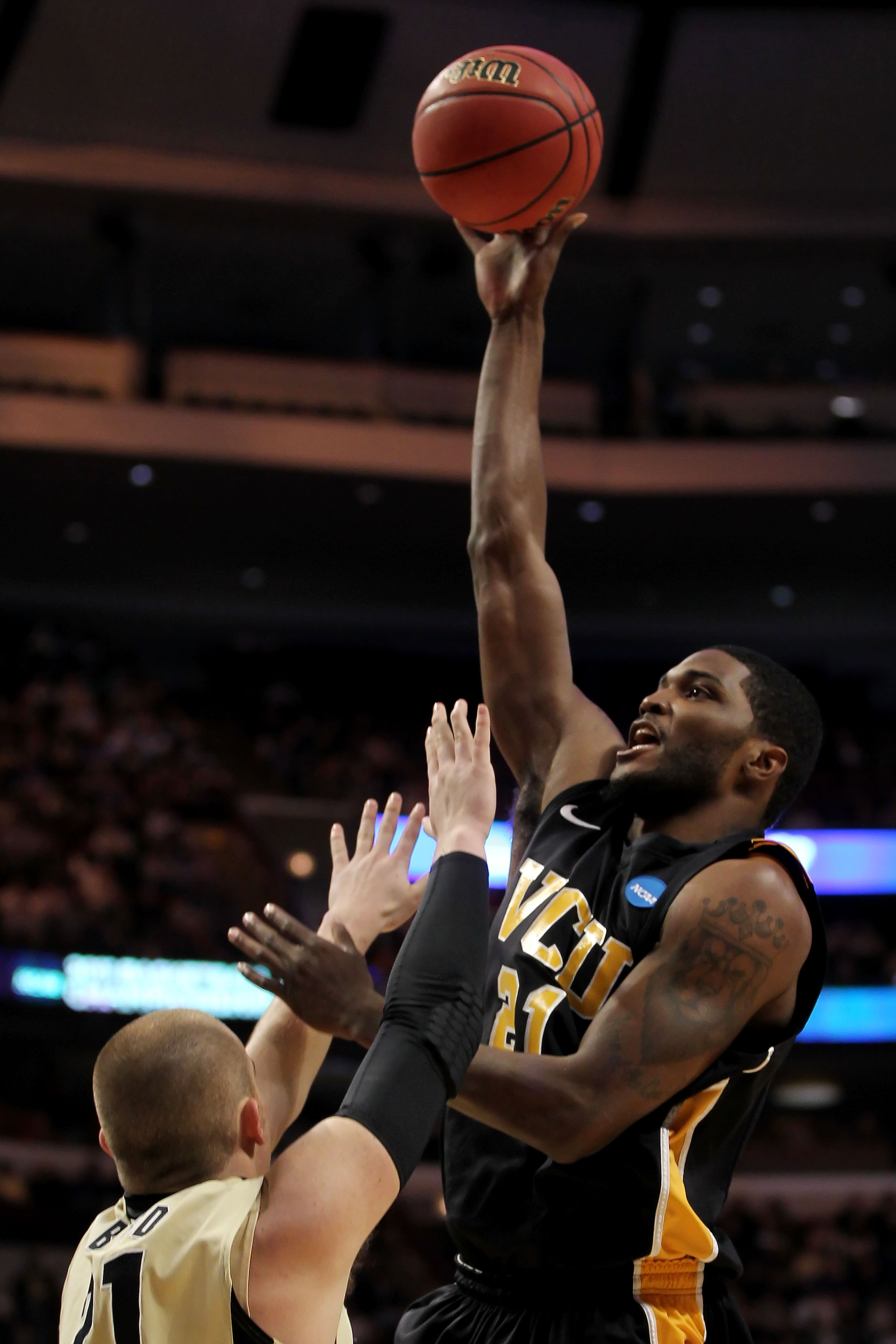 CHICAGO, IL - MARCH 20:  Jamie Skeen #21 of the Virginia Commonwealth Rams shoots against D.J. Byrd #21 of the Purdue Boilermakers in the first half during the third round of the 2011 NCAA men's basketball tournament at the United Center on March 20, 2011