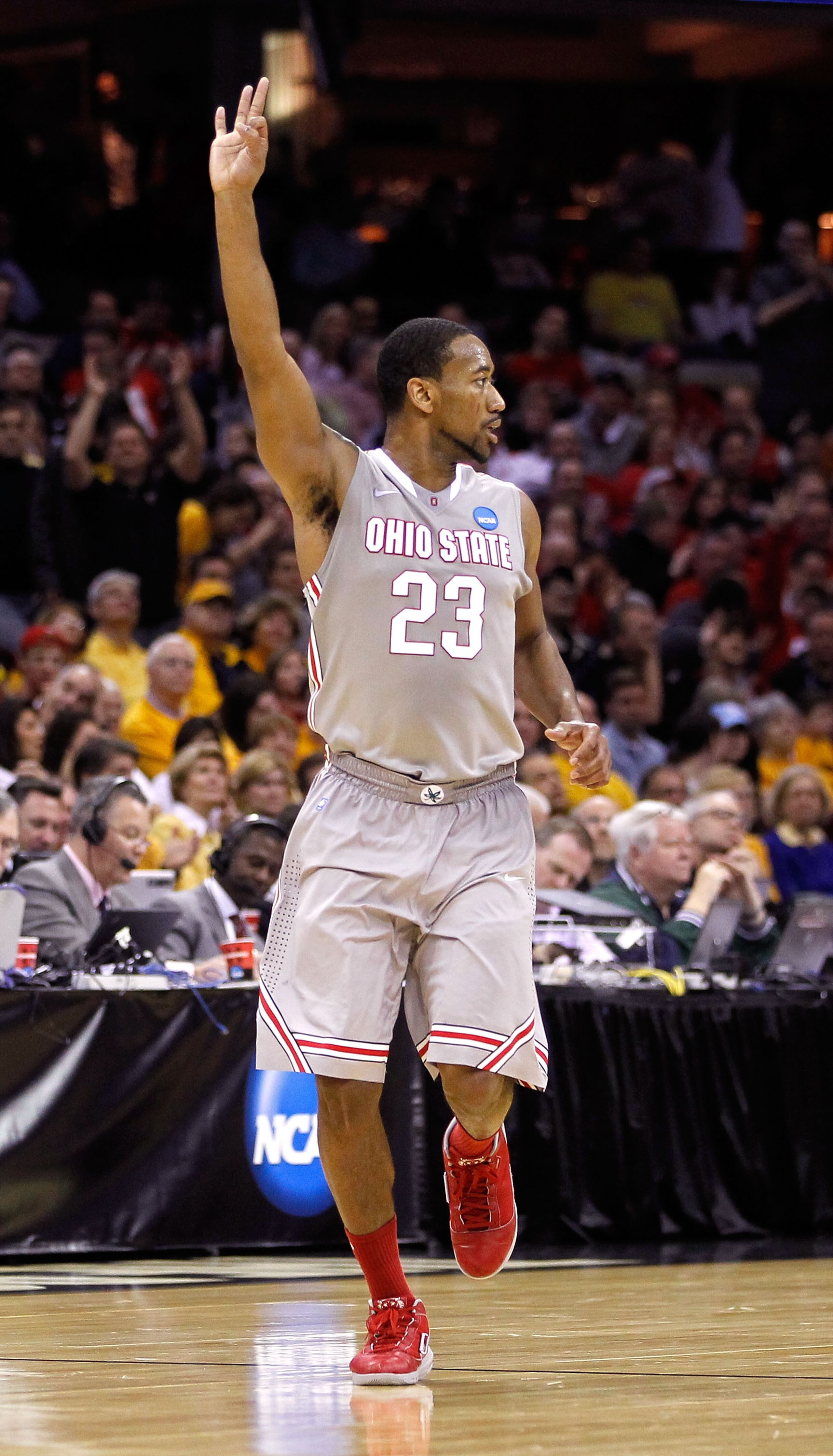 CLEVELAND, OH - MARCH 20:  David Lighty #23 of the Ohio State Buckeyes gestures after making a three point basket against the George Mason Patriots during the third of the 2011 NCAA men's basketball tournament at Quicken Loans Arena on March 20, 2011 in C