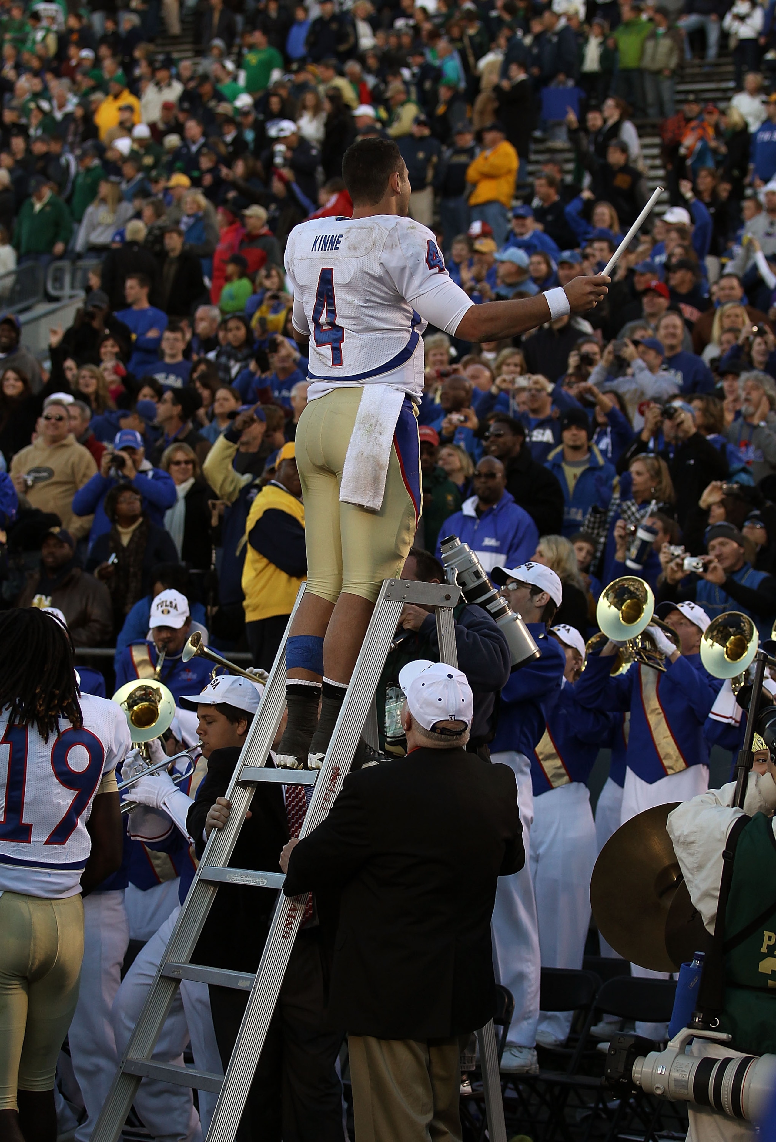 SOUTH BEND, IN - OCTOBER 30: G.J. Kinne #4 of the Tulsa Golden Hurricane conducts the band after a win over the Notre Dame Fighting Irish at Notre Dame Stadium on October 30, 2010 in South Bend, Indiana. Tulsa defeated Notre Dame 28-27. (Photo by Jonathan