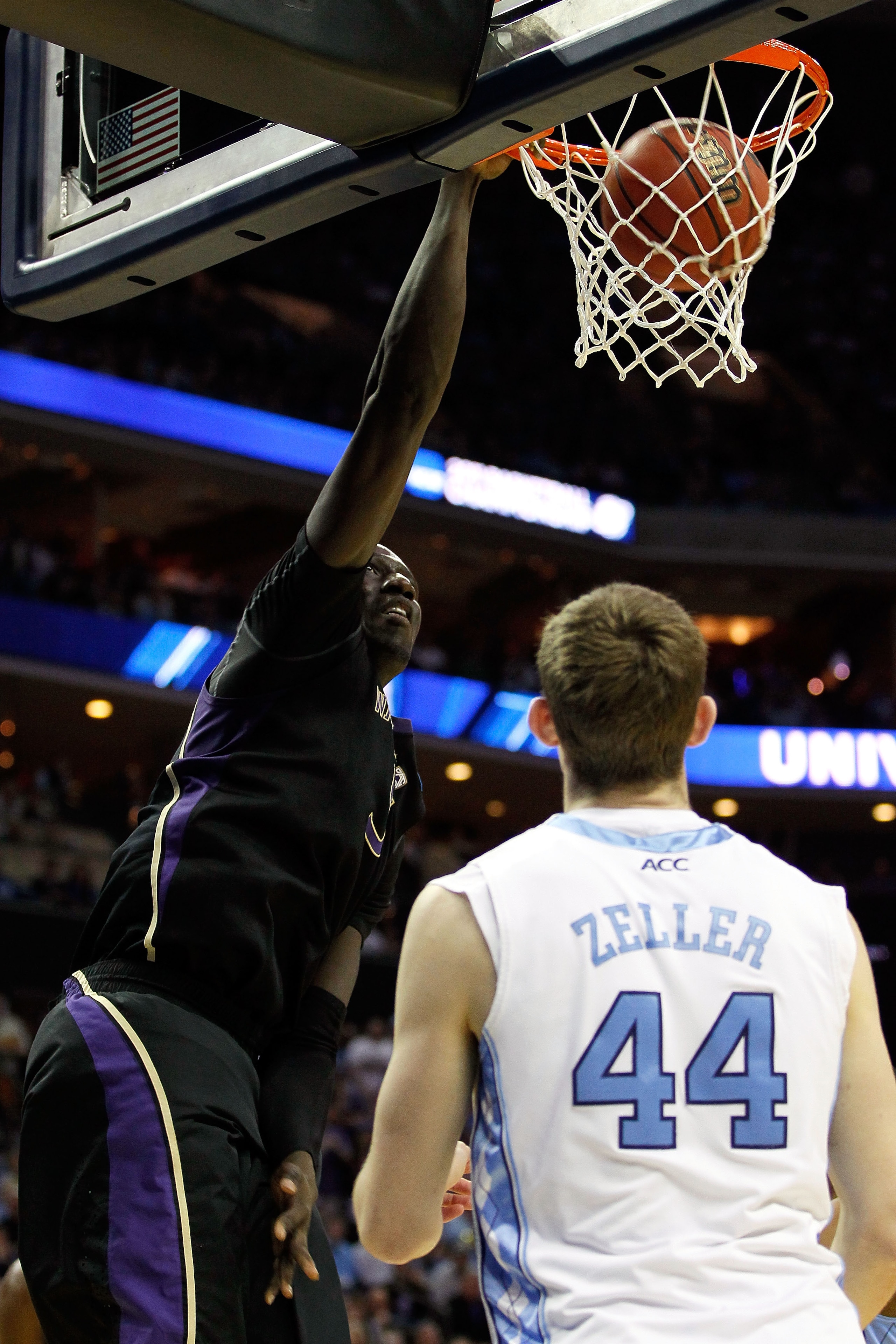 CHARLOTTE, NC - MARCH 20: Aziz N'Diaye #5 of the Washington Huskies dunks the ball over Tyler Zeller #44 of the North Carolina Tar Heels in the first half during the third round of the 2011 NCAA men's basketball tournament at Time Warner Cable Arena on M CHARLOTTE, NC - MARCH 20: Aziz N'Diaye #5 of the Washington Huskies dunks the ball over Tyler Zeller #44 of the North Carolina Tar Heels in the first half during the third round of the 2011 NCAA men's basketball tournament at Time Warner Cable Arena on M