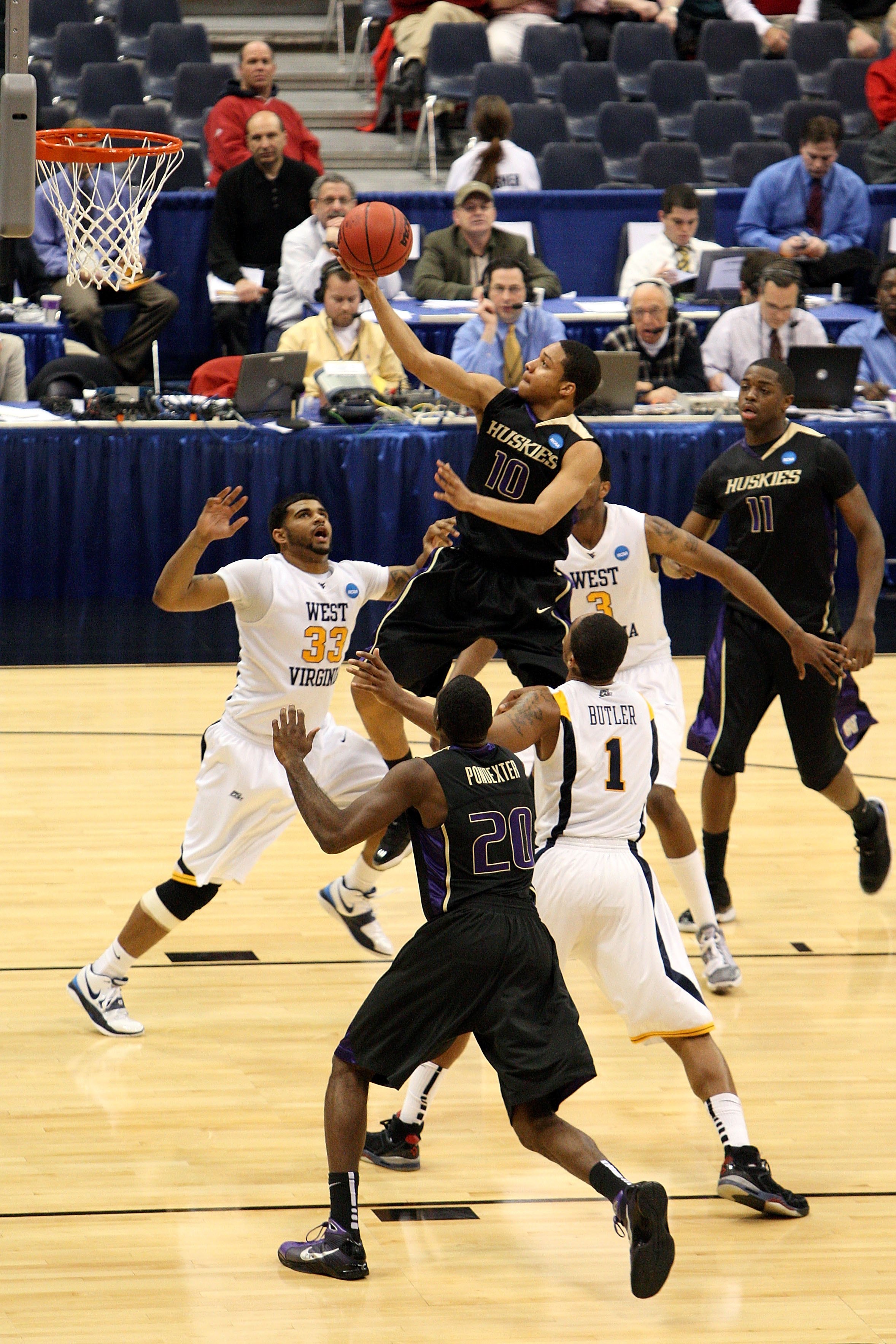 SYRACUSE, NY - MARCH 25: Abdul Gaddy #10 of the Washington Huskies drives for a shot attempt against the West Virginia Mountaineers during the east regional semifinal of the 2010 NCAA men's basketball tournament at the Carrier Dome on March 25, 2010 in S