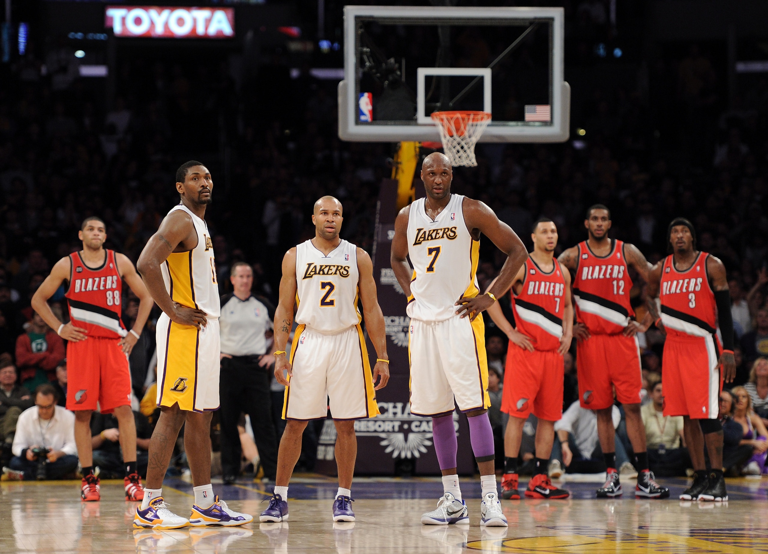 LOS ANGELES, CA - MARCH 20:  Lamar Odom #7, Derek Fisher #2 and Ron Artest #15 of the Los Angeles Lakers watch a free throw off a technical foul during the game against the Portland Trail Blazers at the Staples Center on March 20, 2011 in Los Angeles, Cal