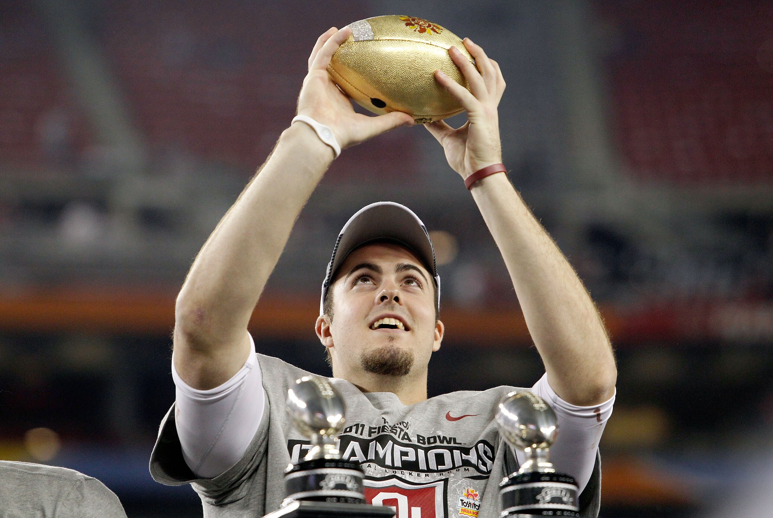 GLENDALE, AZ - JANUARY 01:  Quarterback Landry Jones #12 of the Oklahoma Sooners and offensive MVP celebrates the Sooners 48-20 victory against the Connecticut Huskies during the Tostitos Fiesta Bowl at the Universtity of Phoenix Stadium on January 1, 201