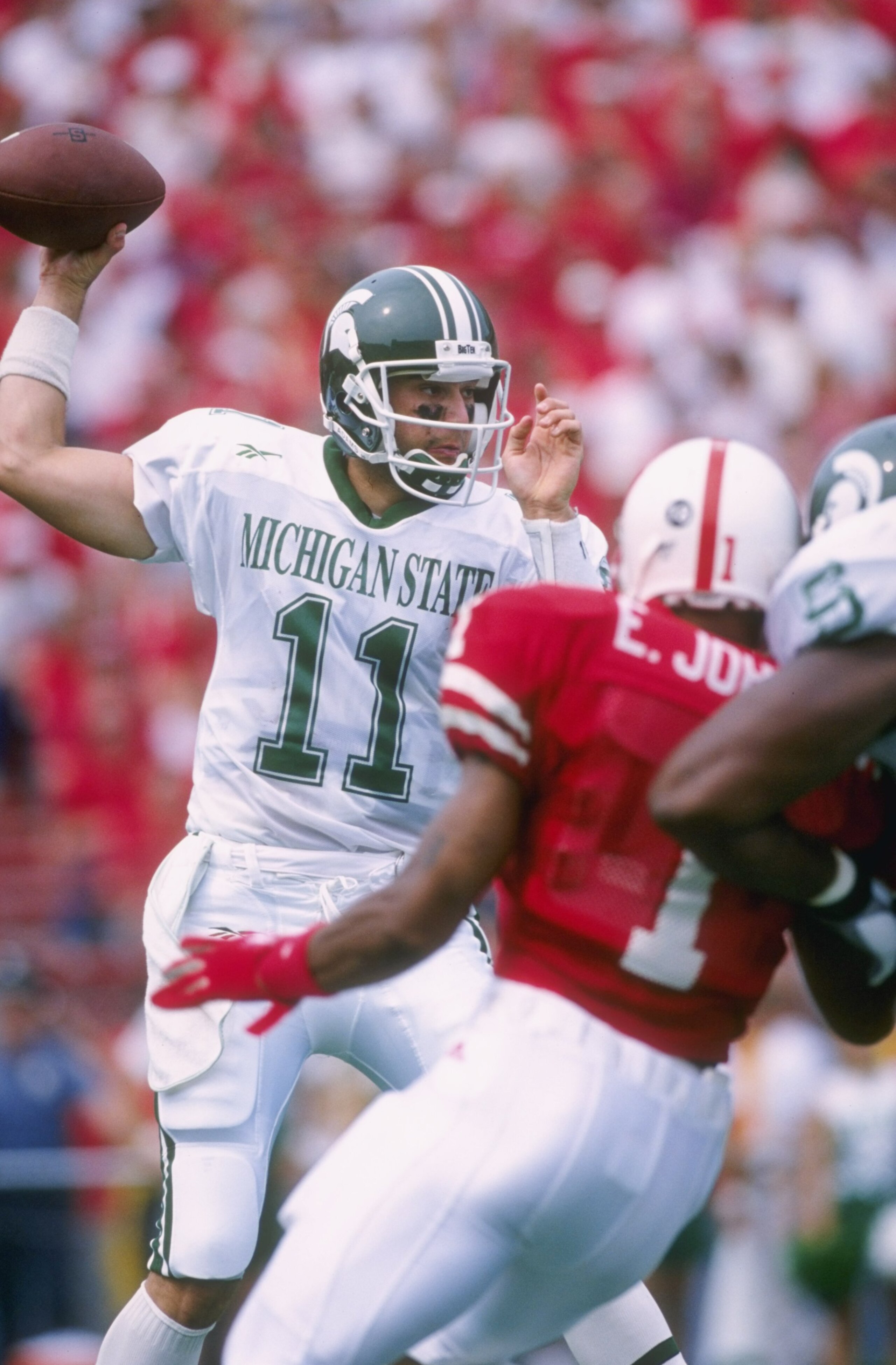 7 Sep 1996:  Quarterback Gus Ornstein #11 of the Michigan State Spartans looks down field for an open receiver as he sets his feet to throw during the Spartans 55-14 loss to the Nebraska Cornhuskers at Memorial Stadium in Lincoln, Nebraska.  Mandatory Cre