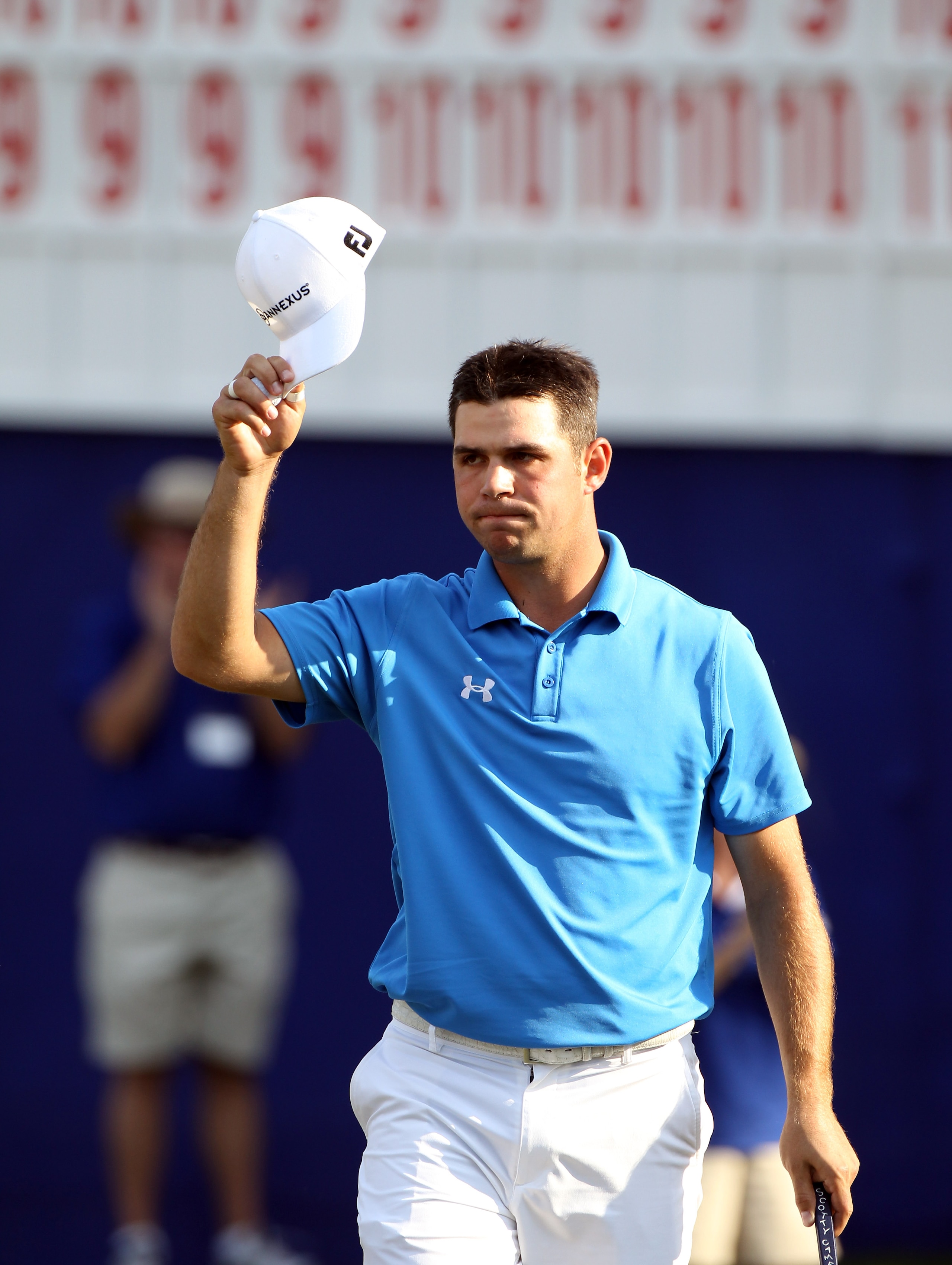 PALM HARBOR, FL - MARCH 20:  Gary Woodland acknowledges the crowd after a par putt on the 18th hole during the final round of the Transitions Championship at Innisbrook Resort and Golf Club on March 20, 2011 in Palm Harbor, Florida.  (Photo by Sam Greenwo