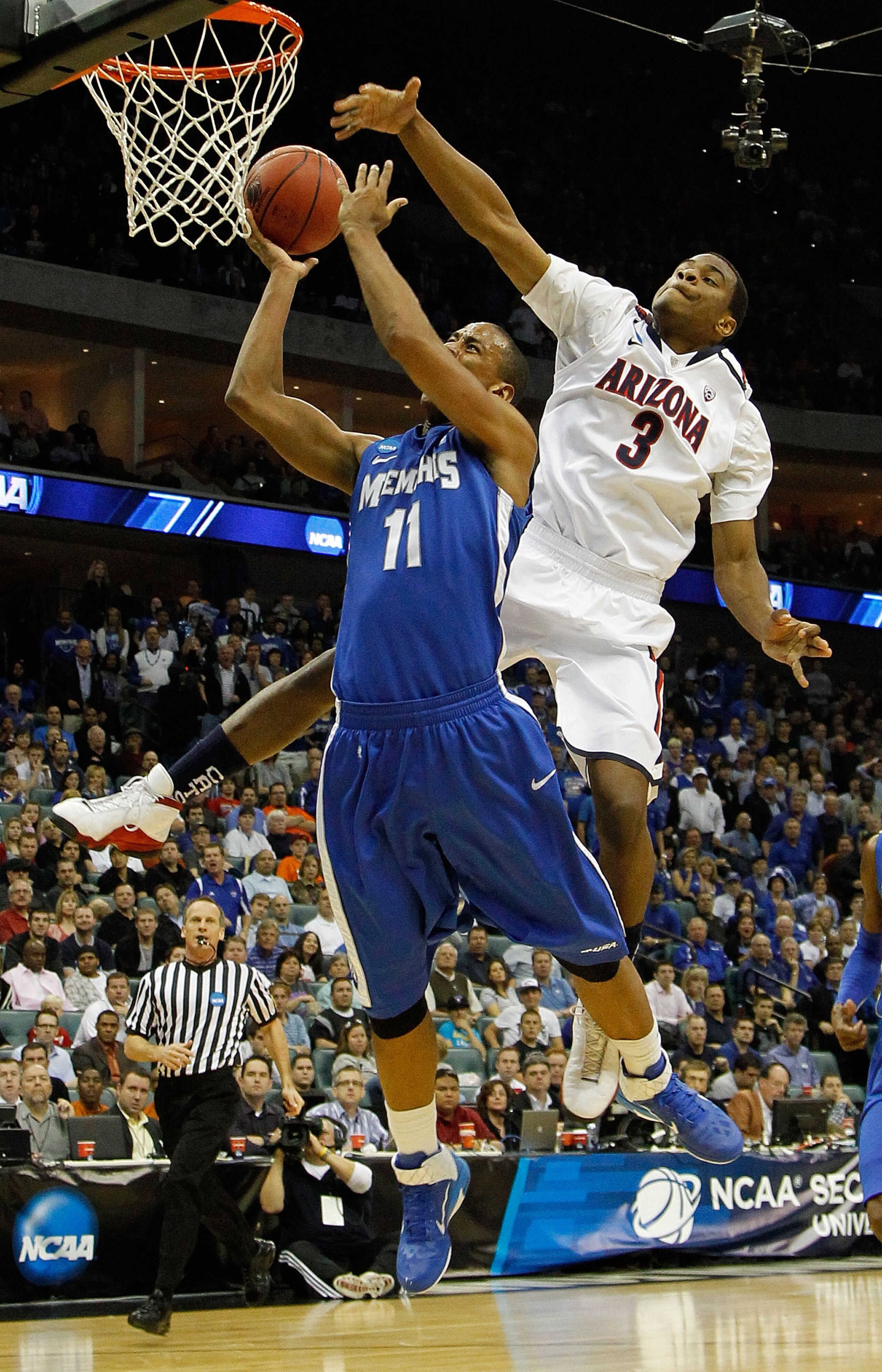 TULSA, OK - MARCH 18:  Kevin Parrom #3 of the Arizona Wildcats looks to block a shot by Wesley Witherspoon #11 of the Memphis Tigers during the second round of the 2011 NCAA men's basketball tournament at BOK Center on March 18, 2011 in Tulsa, Oklahoma.